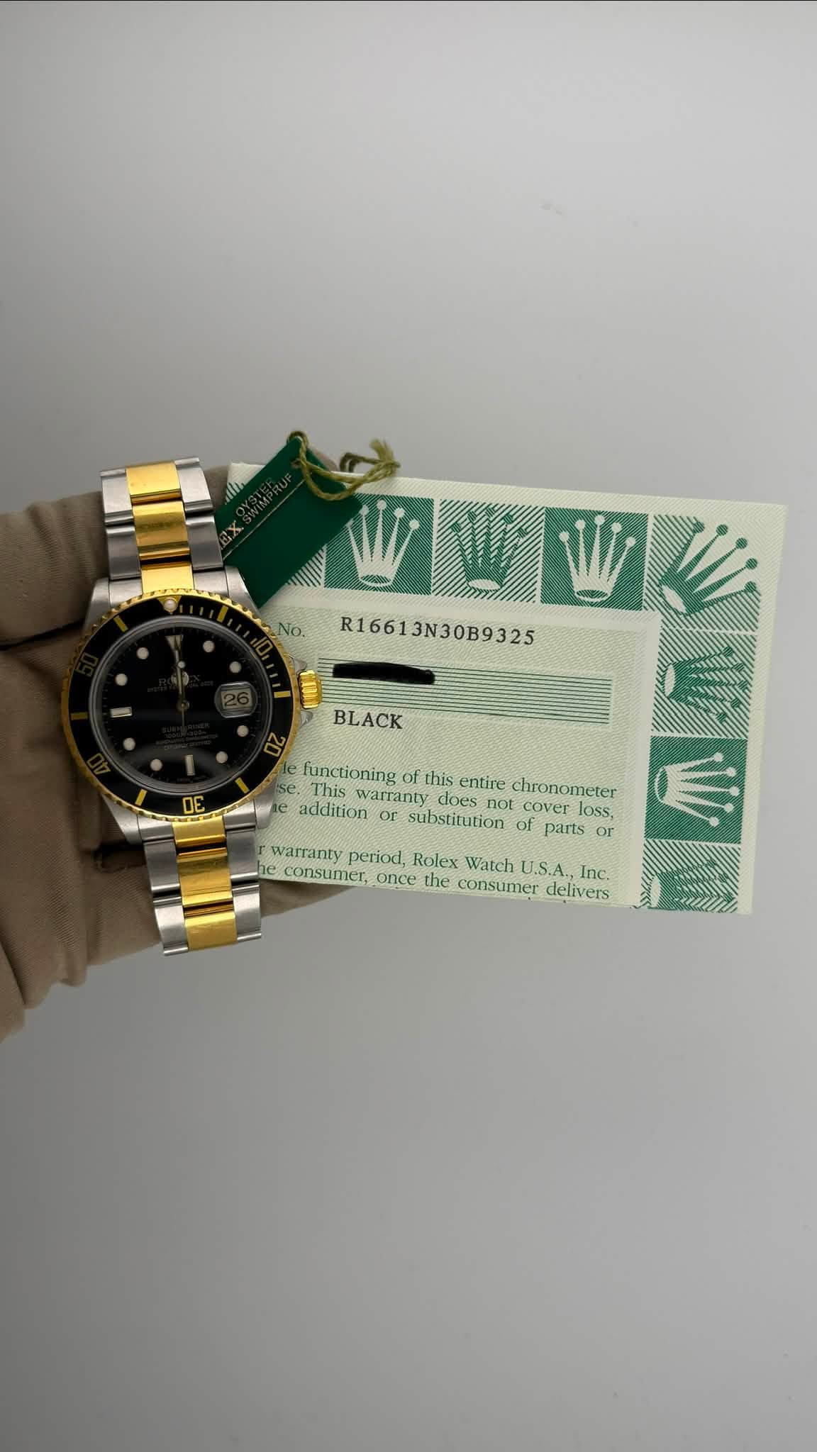 May be an image of wrist watch, money and text that says 'No. R16613N30B9325 BLACK functioning this entire chronometer This warranty does addition cover loss substitution of parts…