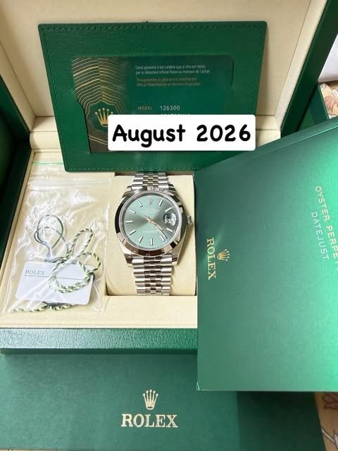 May be an image of wrist watch and text that says '126300 August August2026 2026 キススダリ bạ ROLEX OYSTES OYSTER DATEJUST PERPE ROLEX ROLEX W ROLEX'
