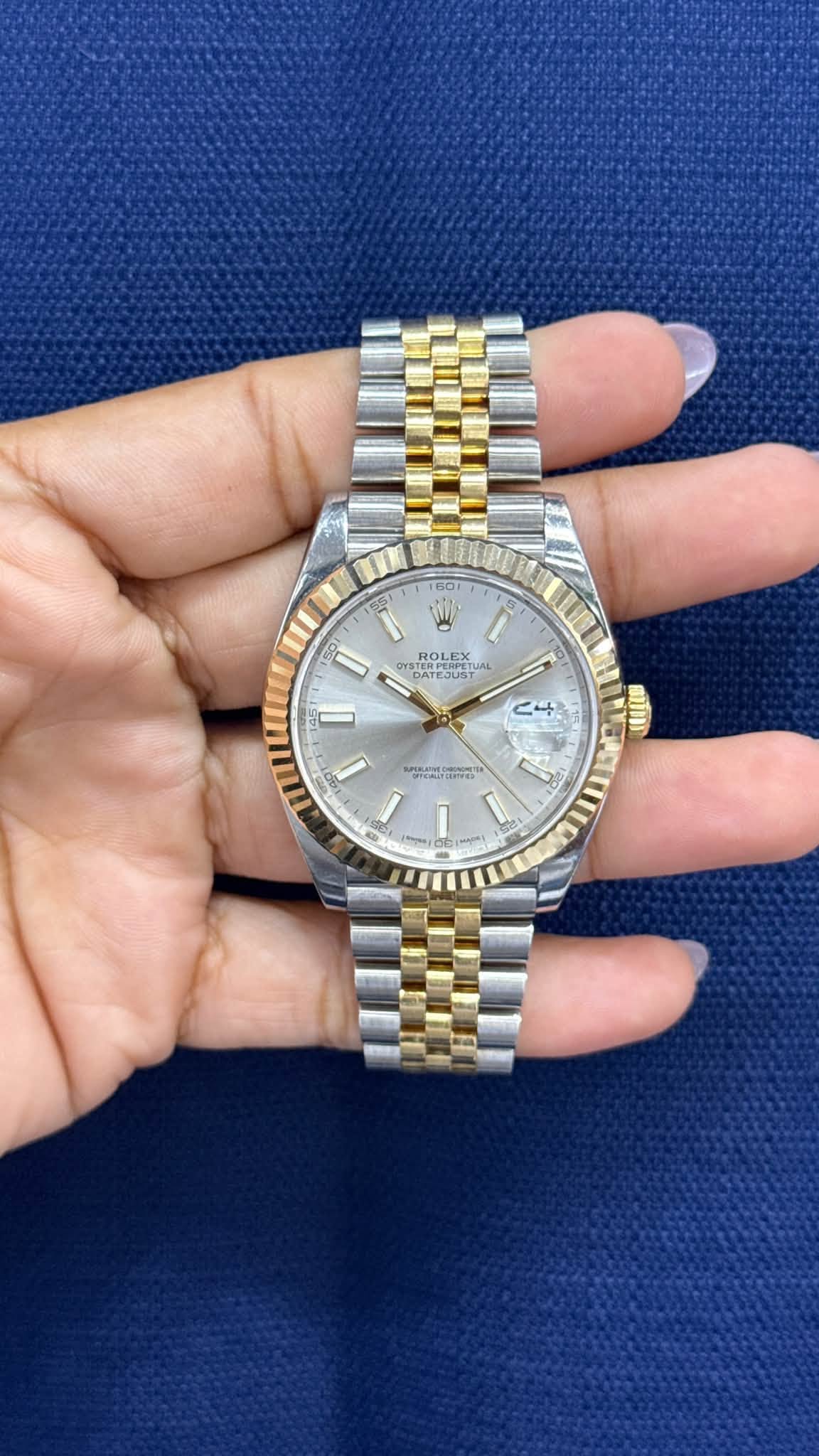 May be an image of wrist watch and text