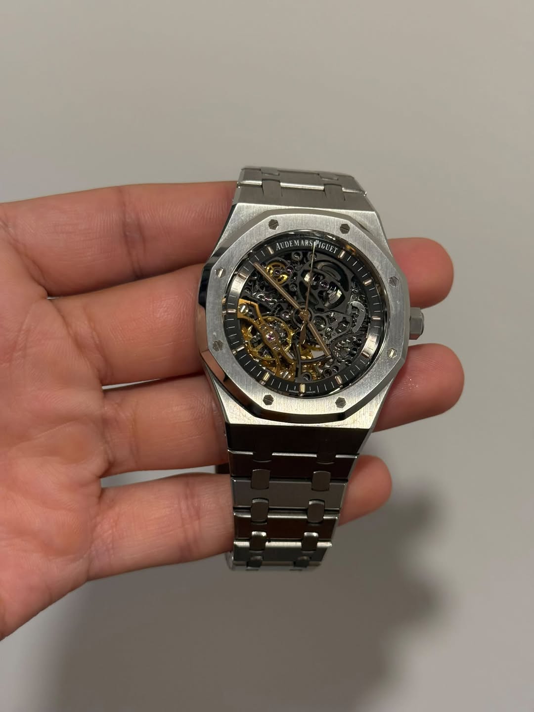 May be an image of wrist watch and text