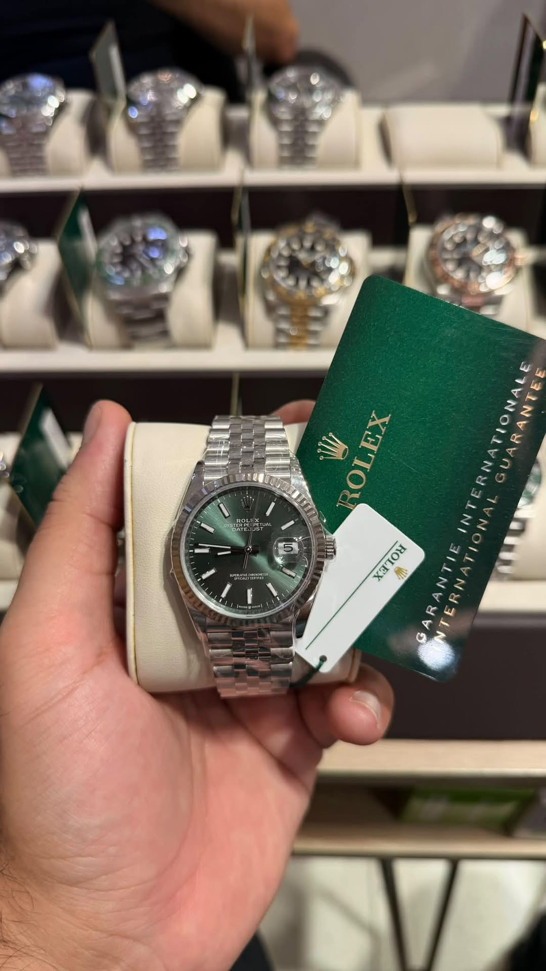 May be an image of wrist watch and text