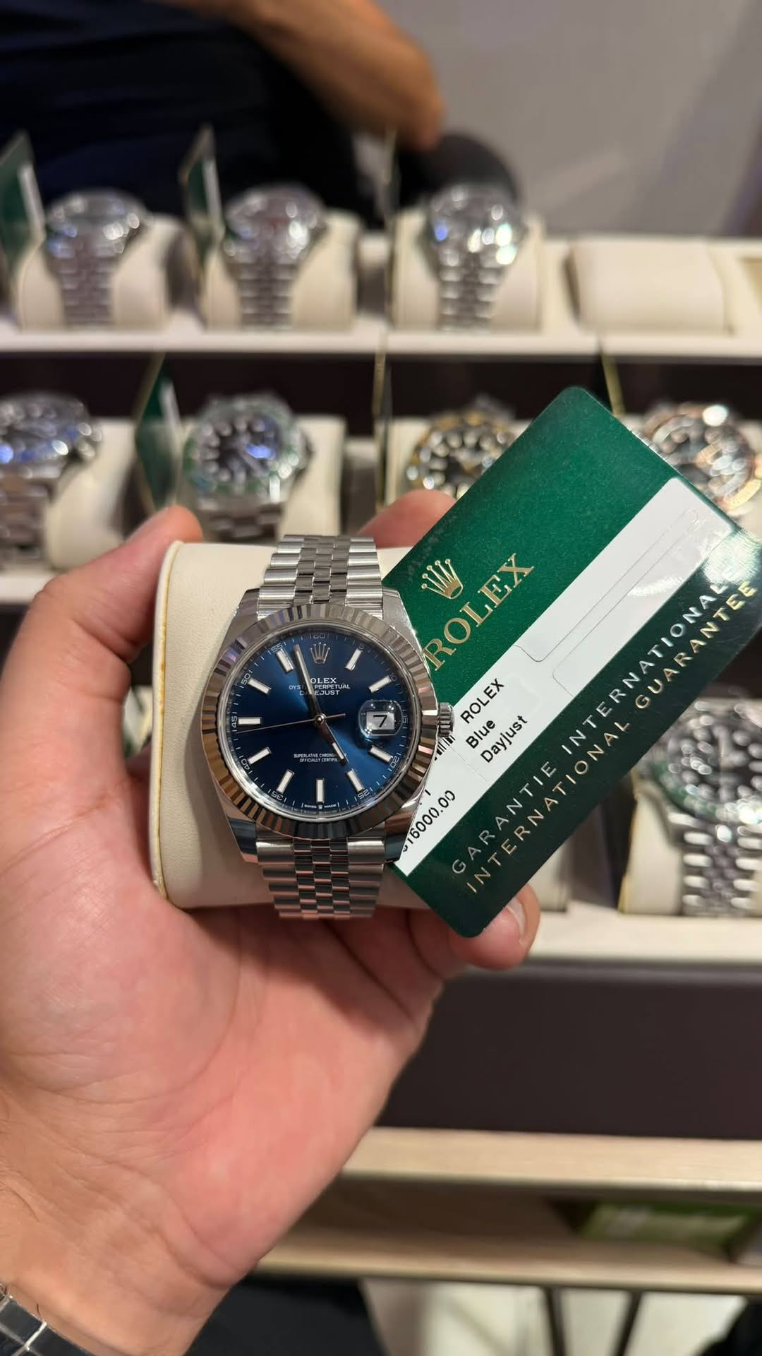 May be an image of wrist watch and text