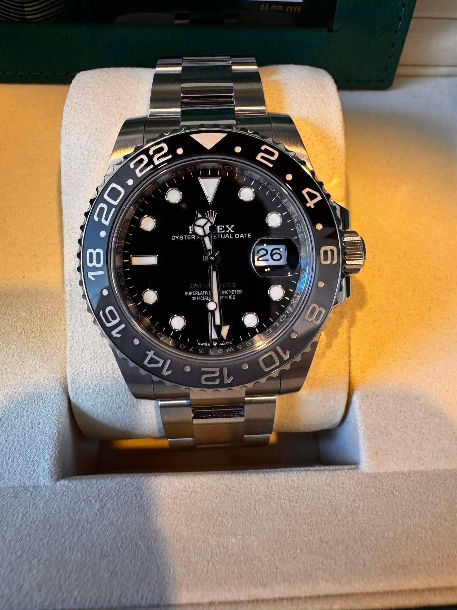 May be an image of wrist watch and text