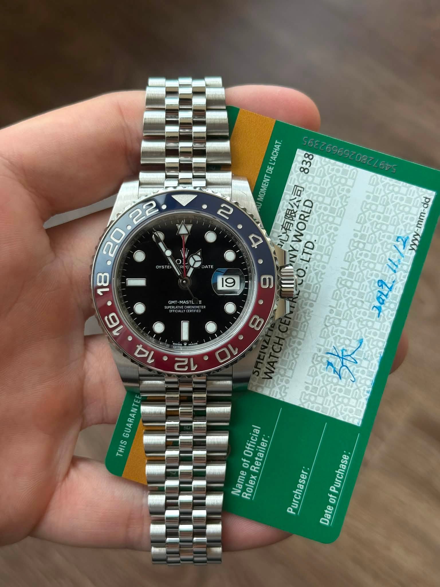 May be an image of wrist watch and text that says 'ב 'ACHAT. DE 838 MOMENT 有限公司 WORLD A NY LTD. dd -mm- GUARANTE THIS Official RolexRetailer: Retailer: Name f Rolex Purchaser…