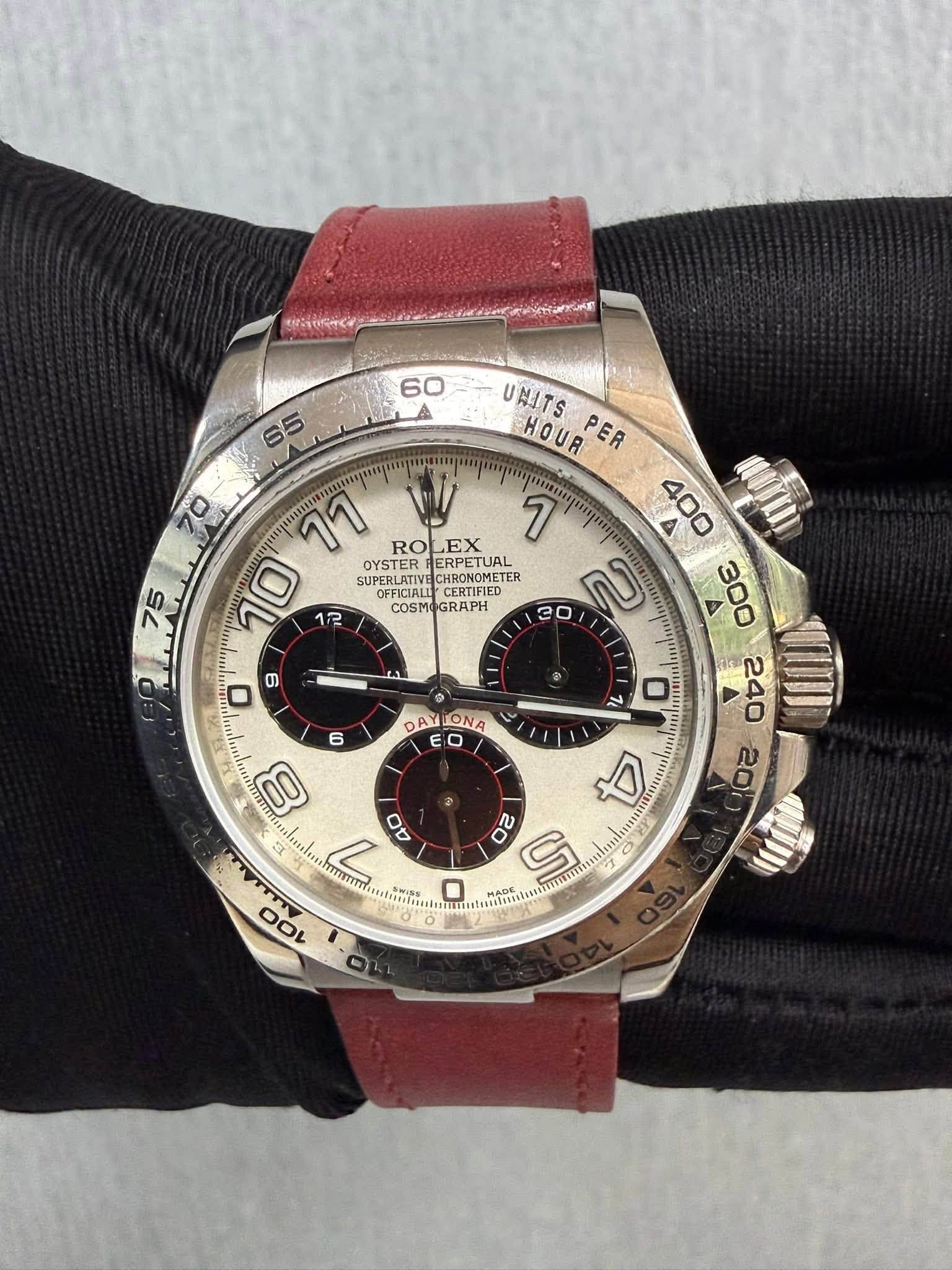 May be an image of wrist watch and text