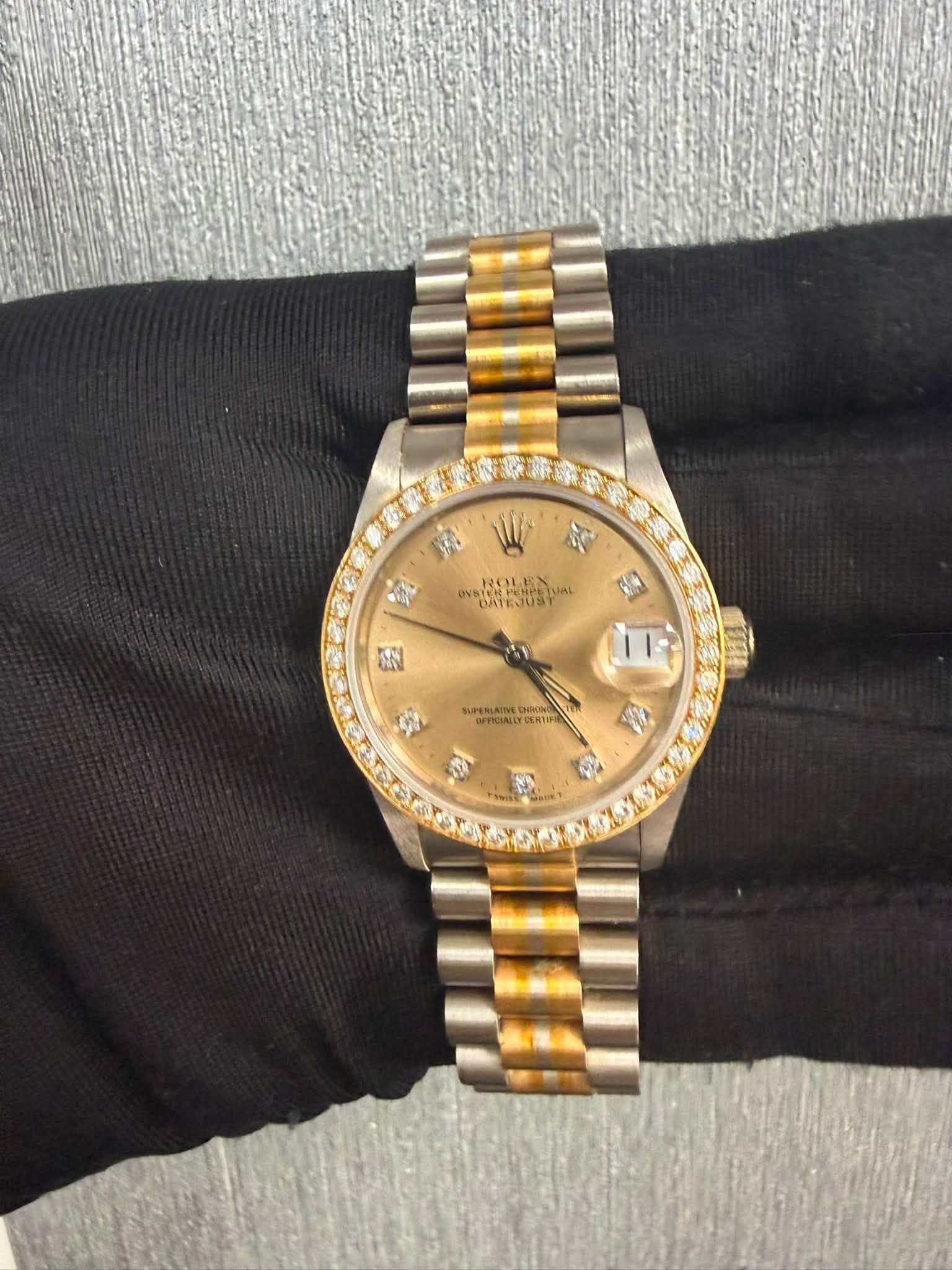 May be an image of wrist watch and text