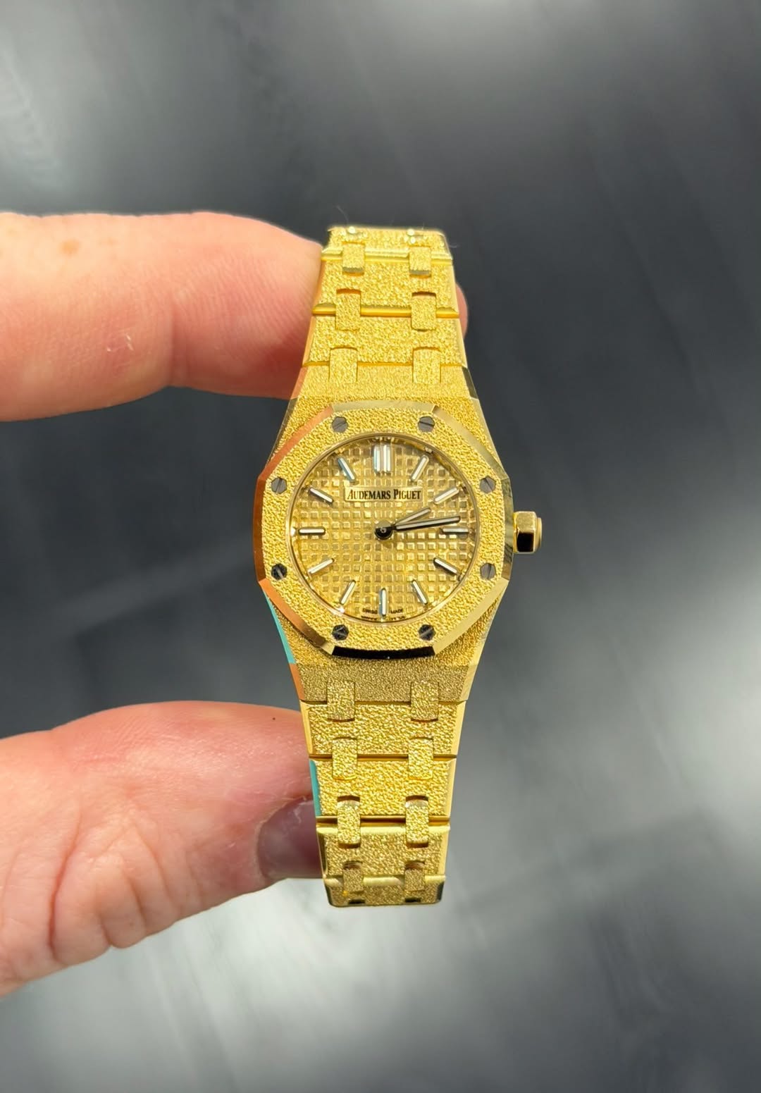 May be an image of wrist watch and text