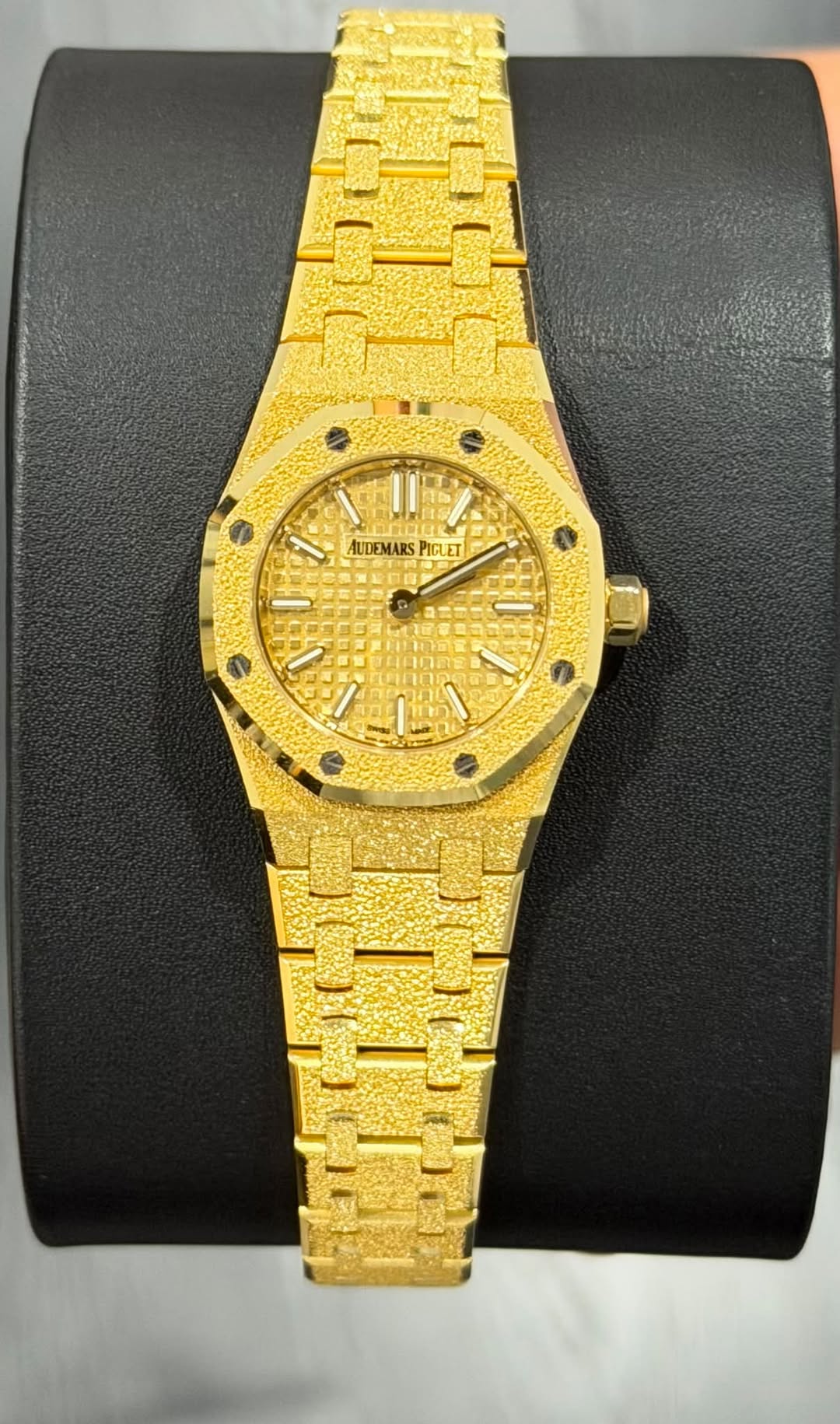 May be an image of wrist watch and text