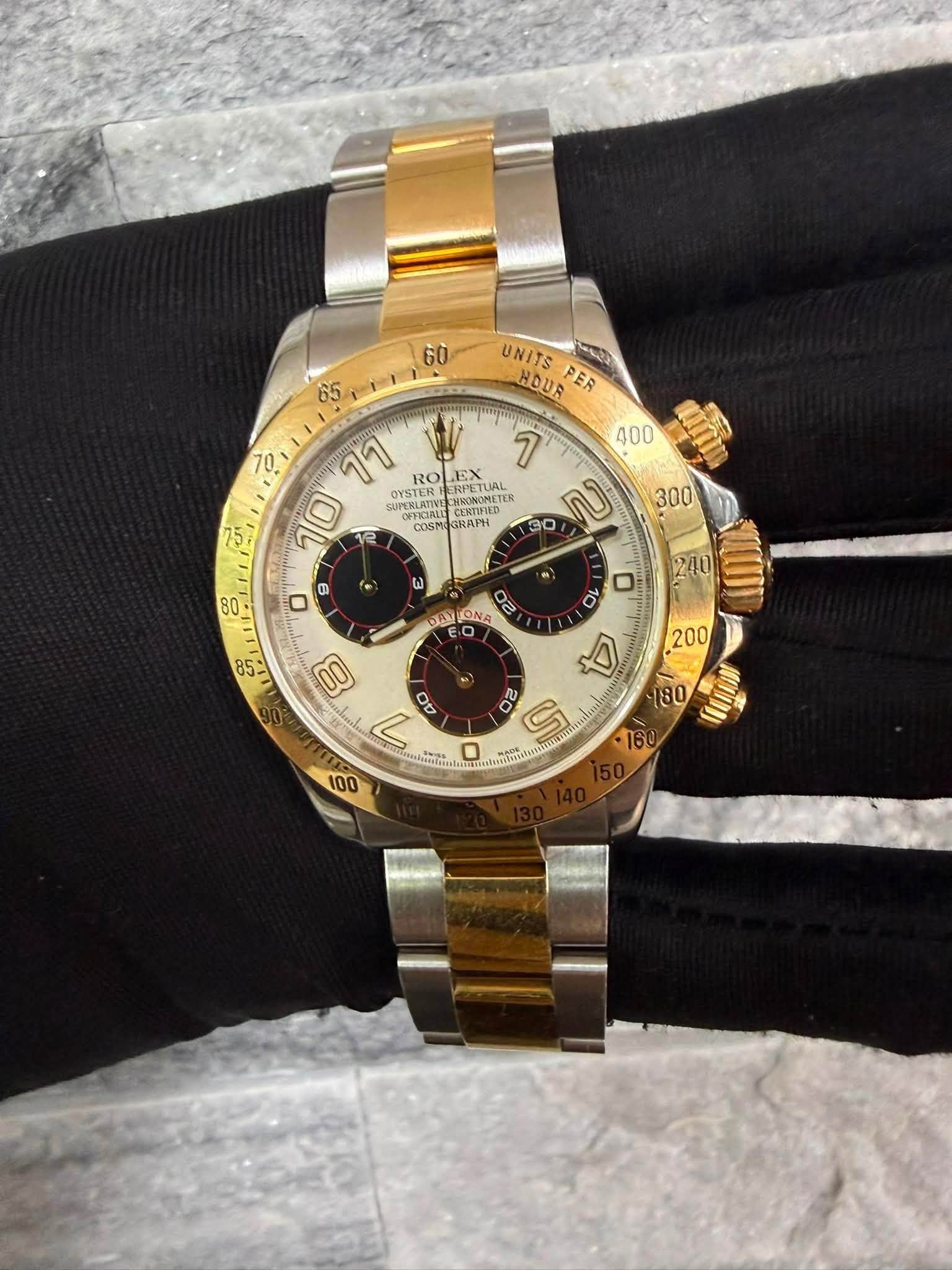 May be an image of wrist watch and text