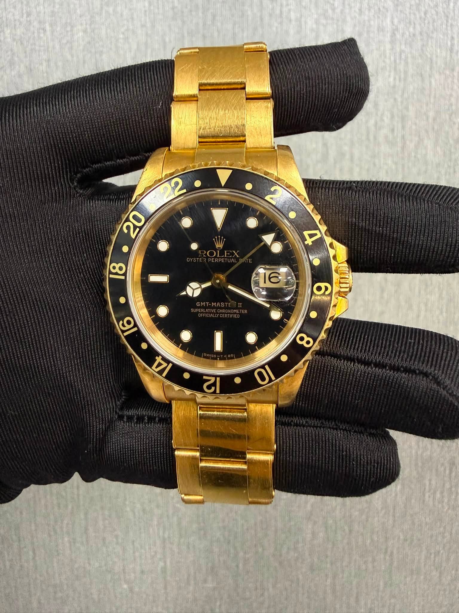 May be an image of wrist watch and text