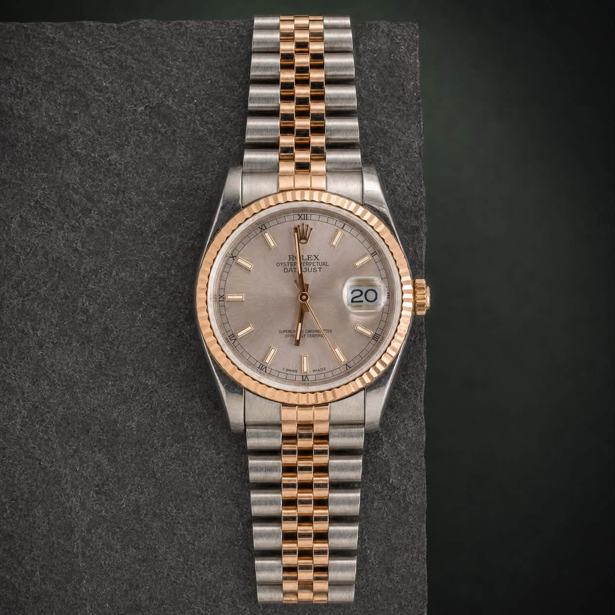 May be an image of wrist watch and text