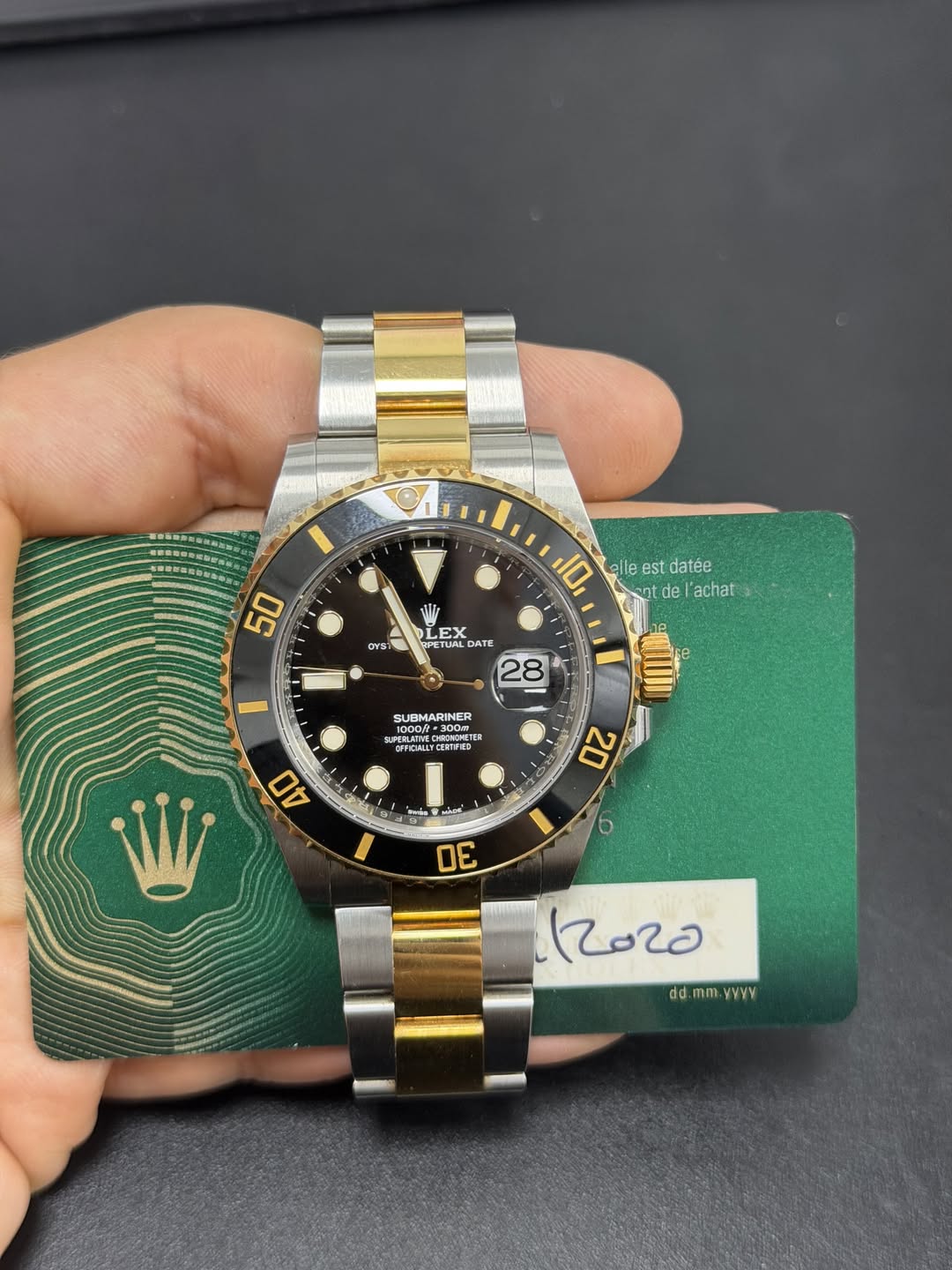 May be an image of wrist watch and text