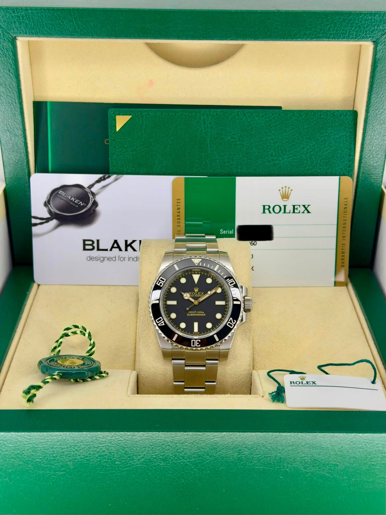May be an image of wrist watch and text that says 'BLAKEN BLAKEN E ROLEX Serial BLAK! designed designedForindi for indi ROI ROLEX'