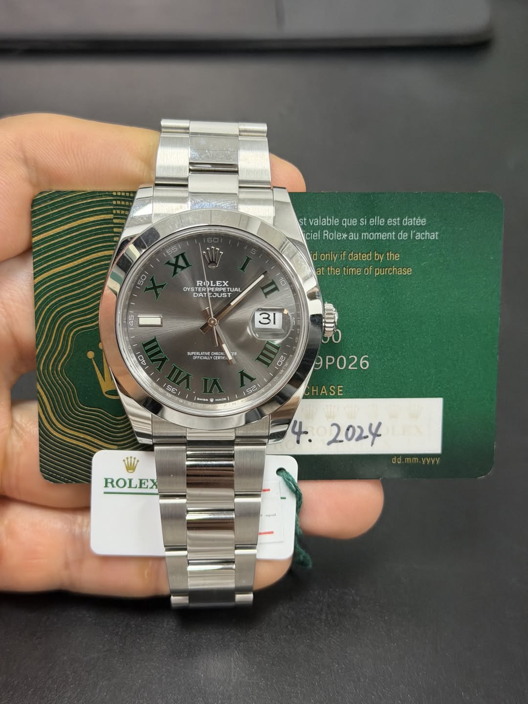 May be an image of wrist watch and text that says 'SS 50 stvalablequesiellestdatée st valable que elle est datée ciel ciel.Roleaumamentdel'achat Rolexau moment de 'achat onlyif…