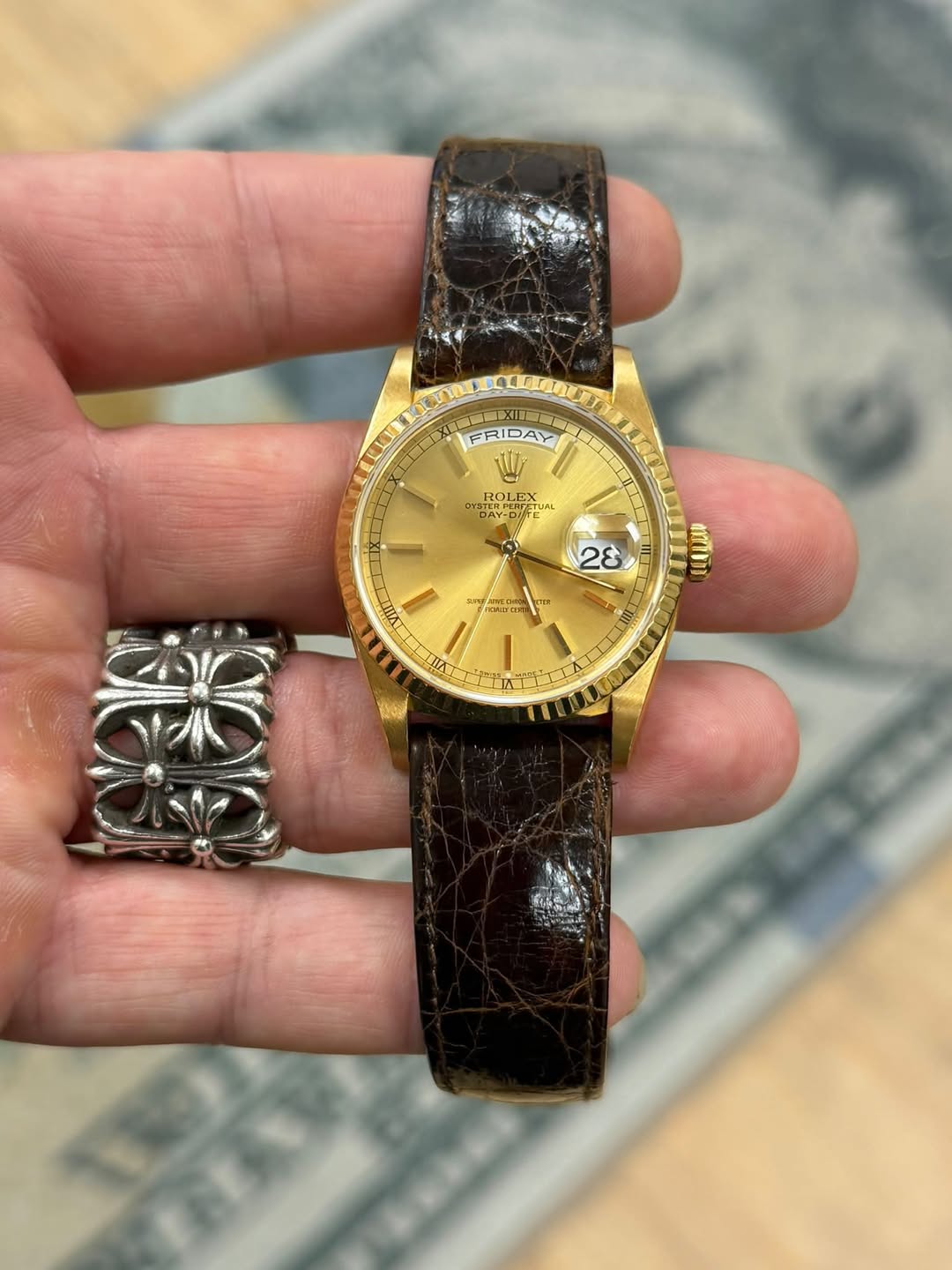 May be an image of wrist watch and text