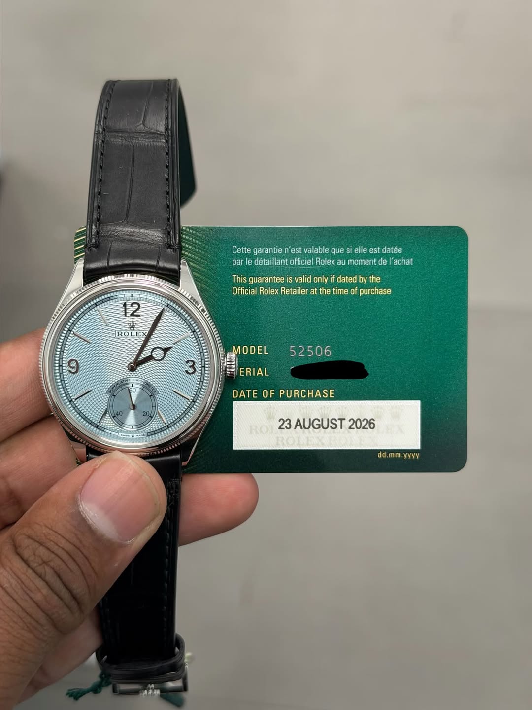 May be an image of wrist watch and text that says 'Cette garantie est tteperterteseieteseed valable ques elle estdatée ant warelillillelee officiel Rolex momentde achat…