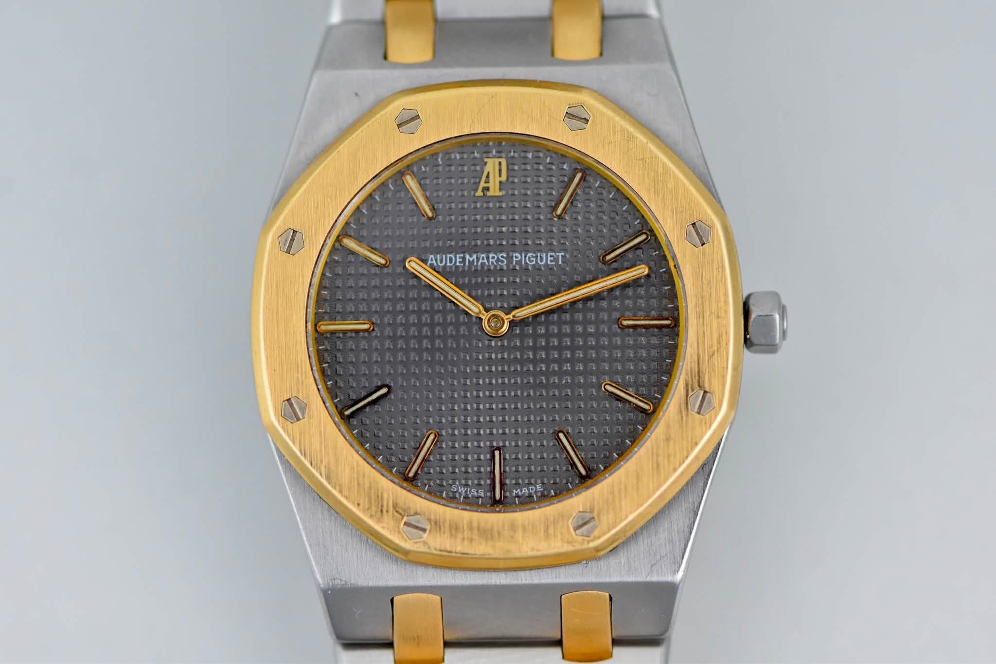 May be an image of wrist watch and text that says 'A AUDEMARSPIGUET AUDEMARS PIGUET D F MADE'