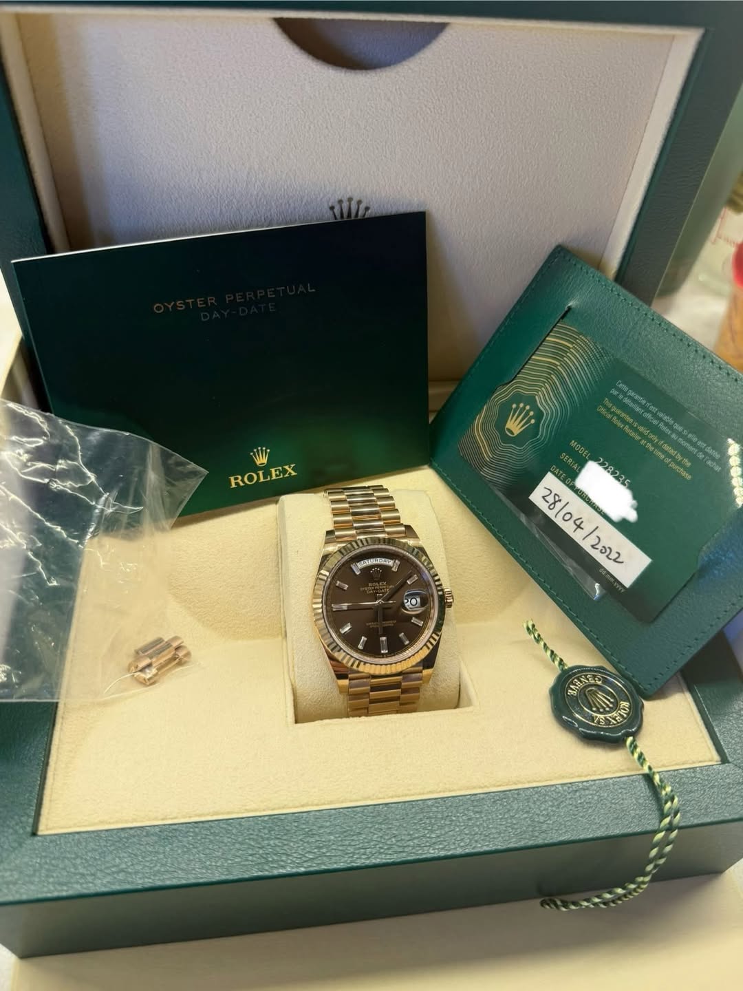 May be an image of wrist watch and text
