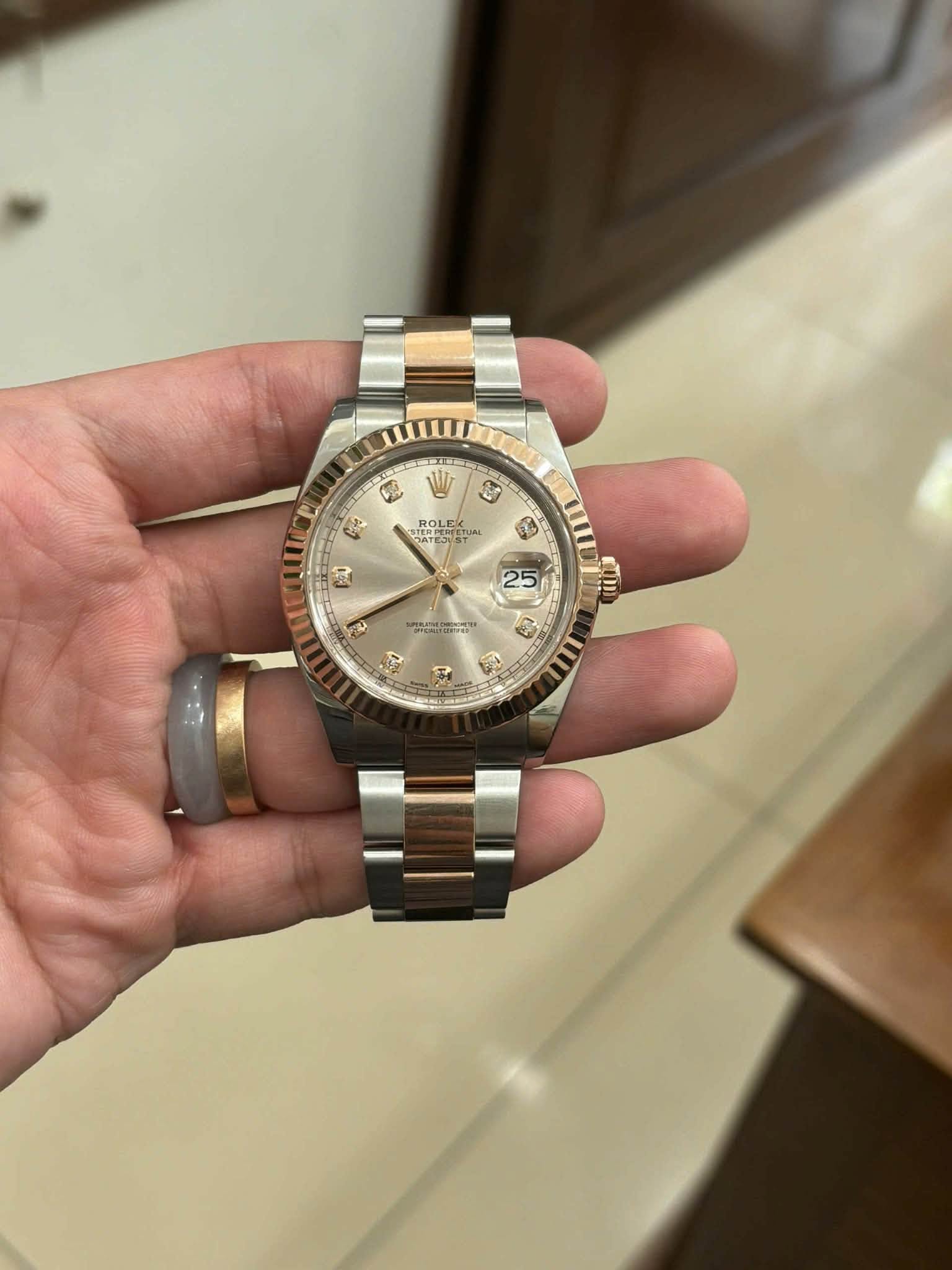 May be an image of wrist watch and text