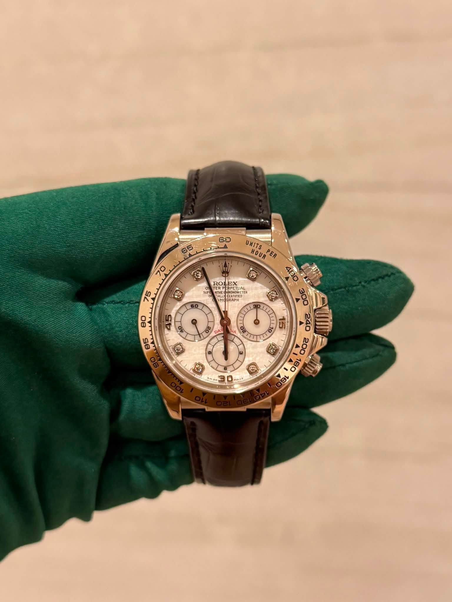 May be an image of wrist watch and text