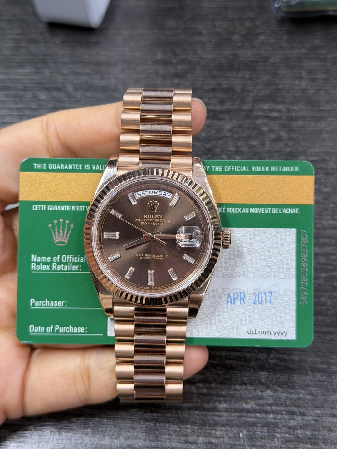 May be an image of wrist watch and text that says 'THIS GUARANTEE IS VALIT THEOFFICIALROLEXRETAILER THE OFFICIAL ROLEX RETAILER. CETTEGARANTIEN'EST CETTE GARANTIE N'EST SATURDAY…