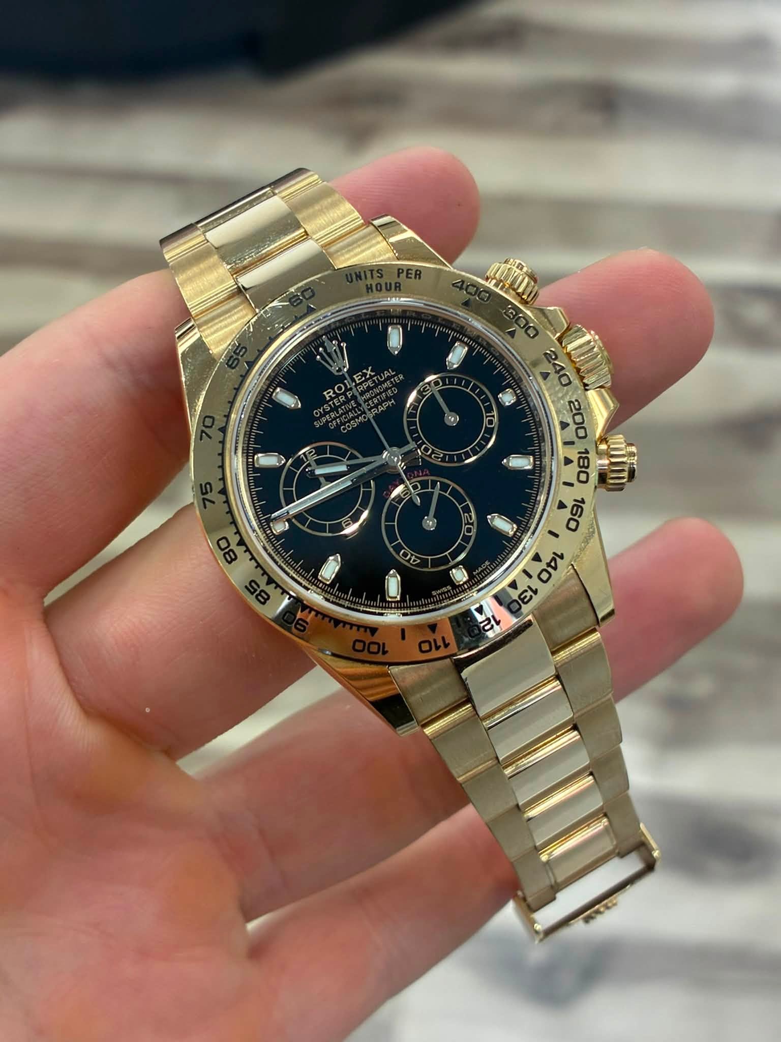 May be an image of wrist watch and text