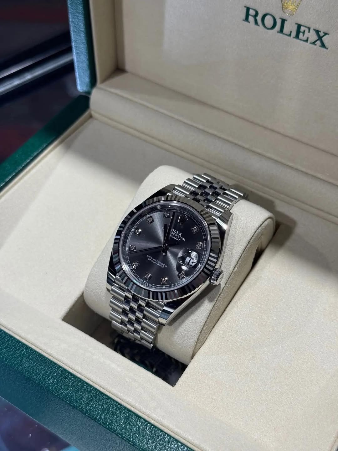 May be an image of wrist watch and text