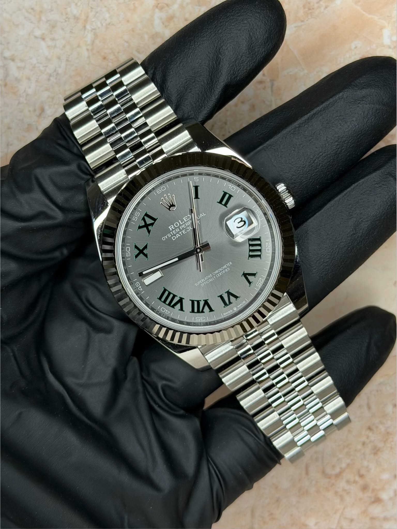 May be an image of wrist watch and text