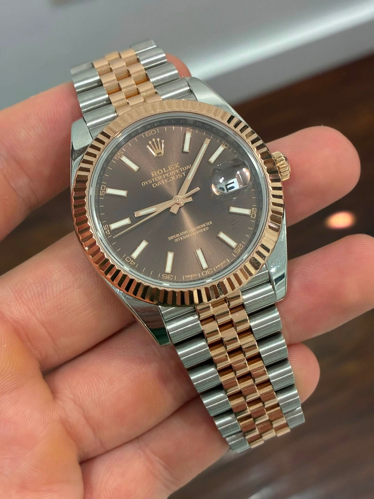 May be an image of wrist watch and text