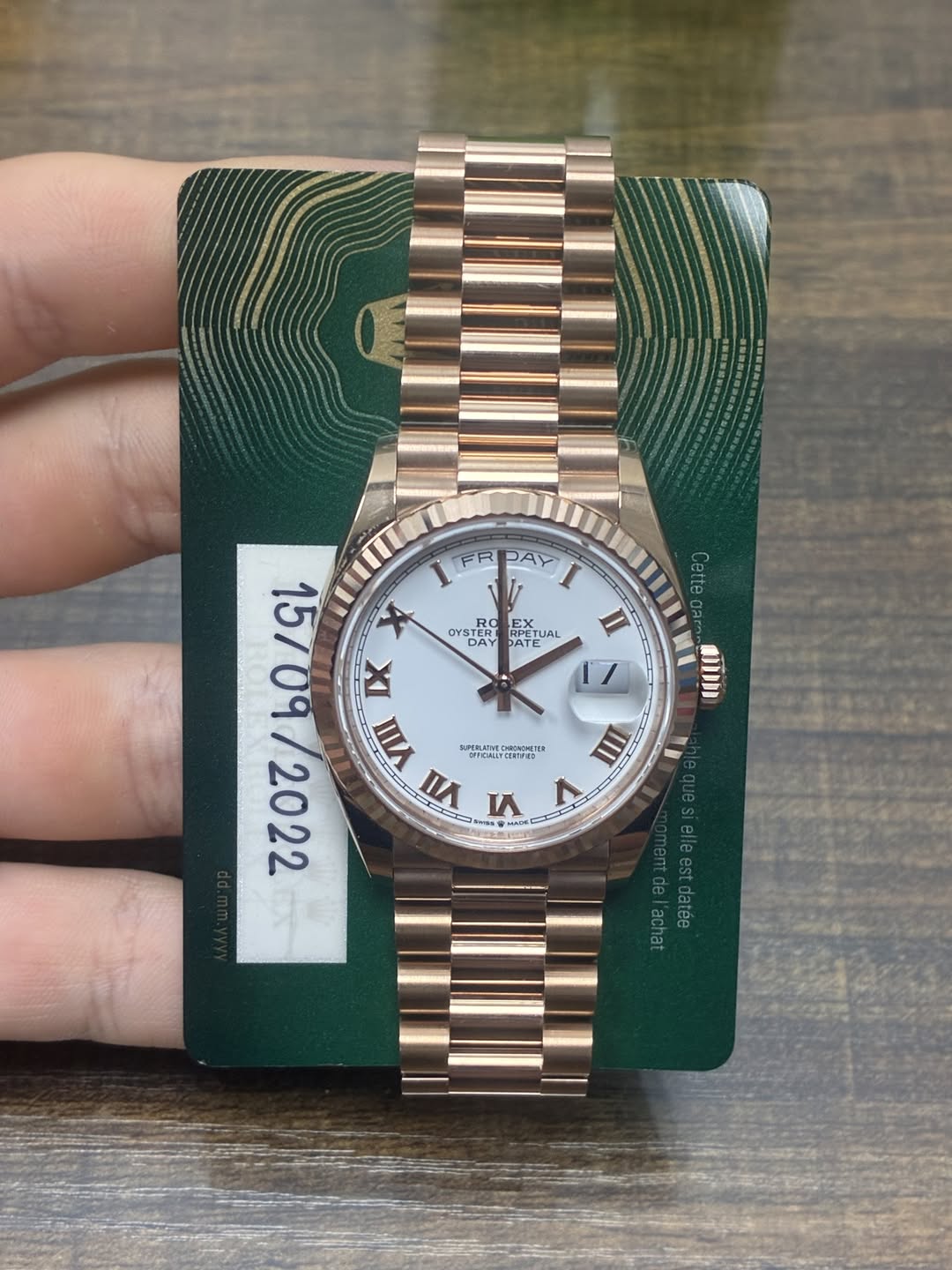 May be an image of wrist watch and text