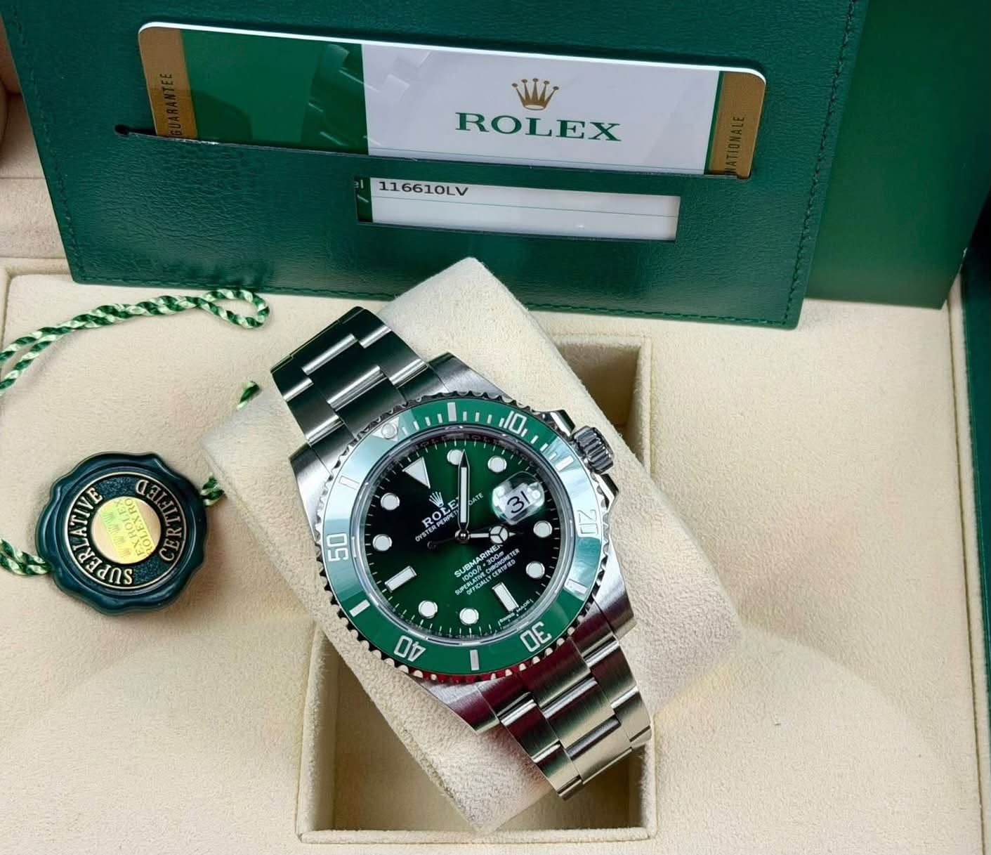 May be an image of wrist watch and text that says 'W ROLEX 116610LV 10 E αθΙ นขาง da จก E KP ROL 50 20 PERLAU 40 DE I'