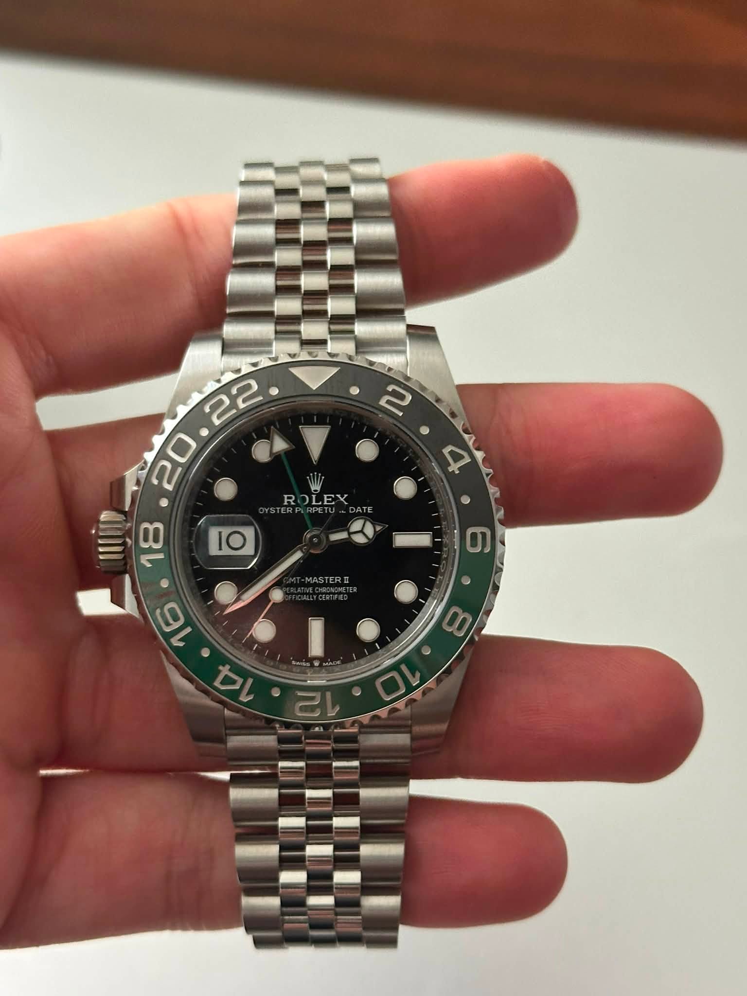 May be an image of wrist watch and text