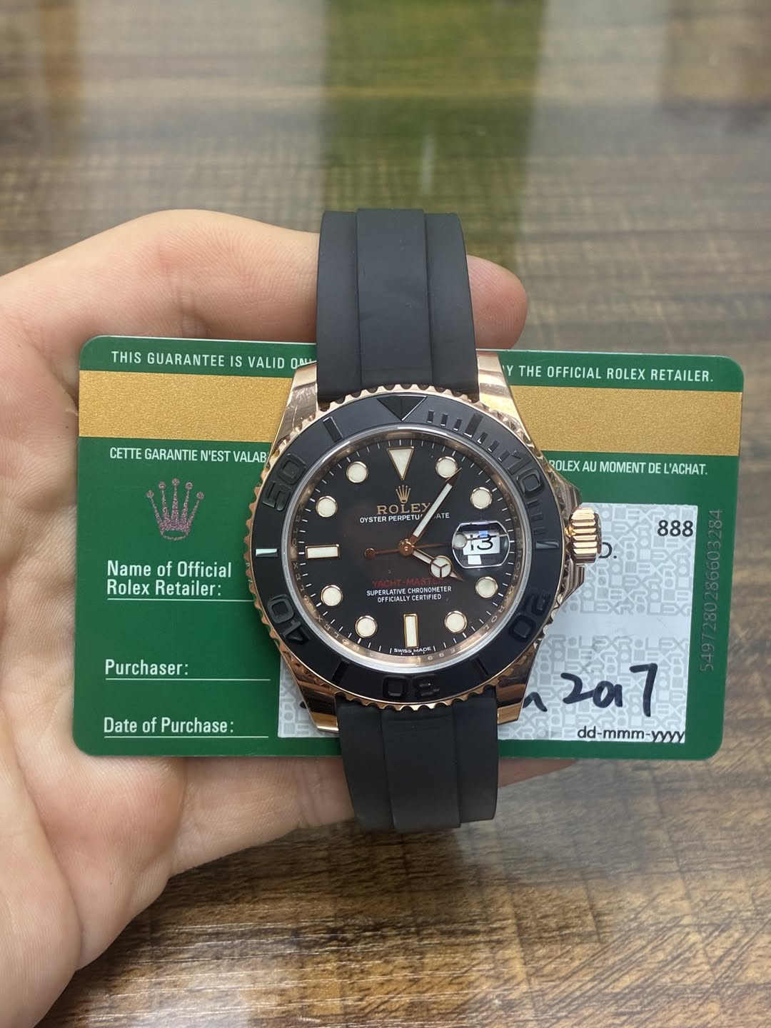 May be an image of wrist watch and text that says 'THIS GUARANTEE IS VALID መይራ Y THE OFFICIAL THEOFFICIALROLEXRETAILER. ROLEX RETAILER. CETTE GARANTIE N'EST…
