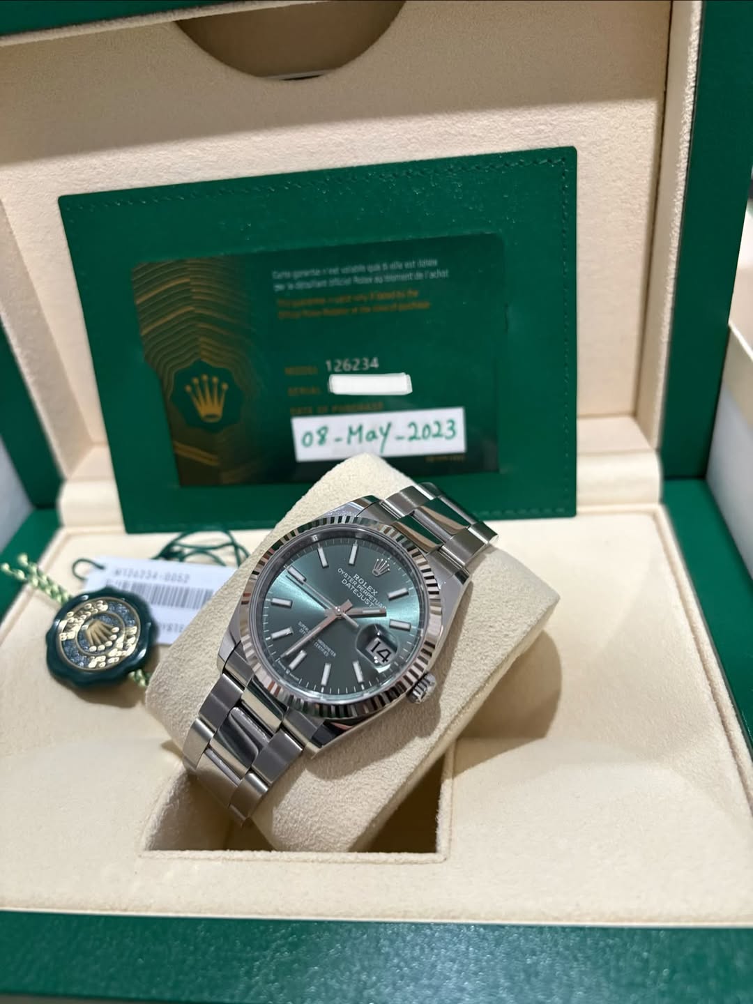 May be an image of wrist watch and text