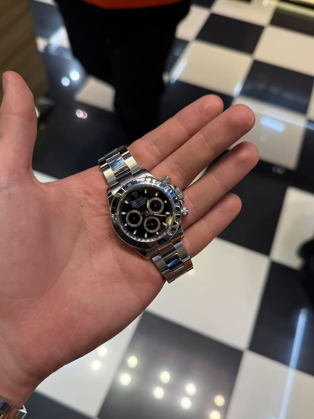 May be an image of wrist watch and text