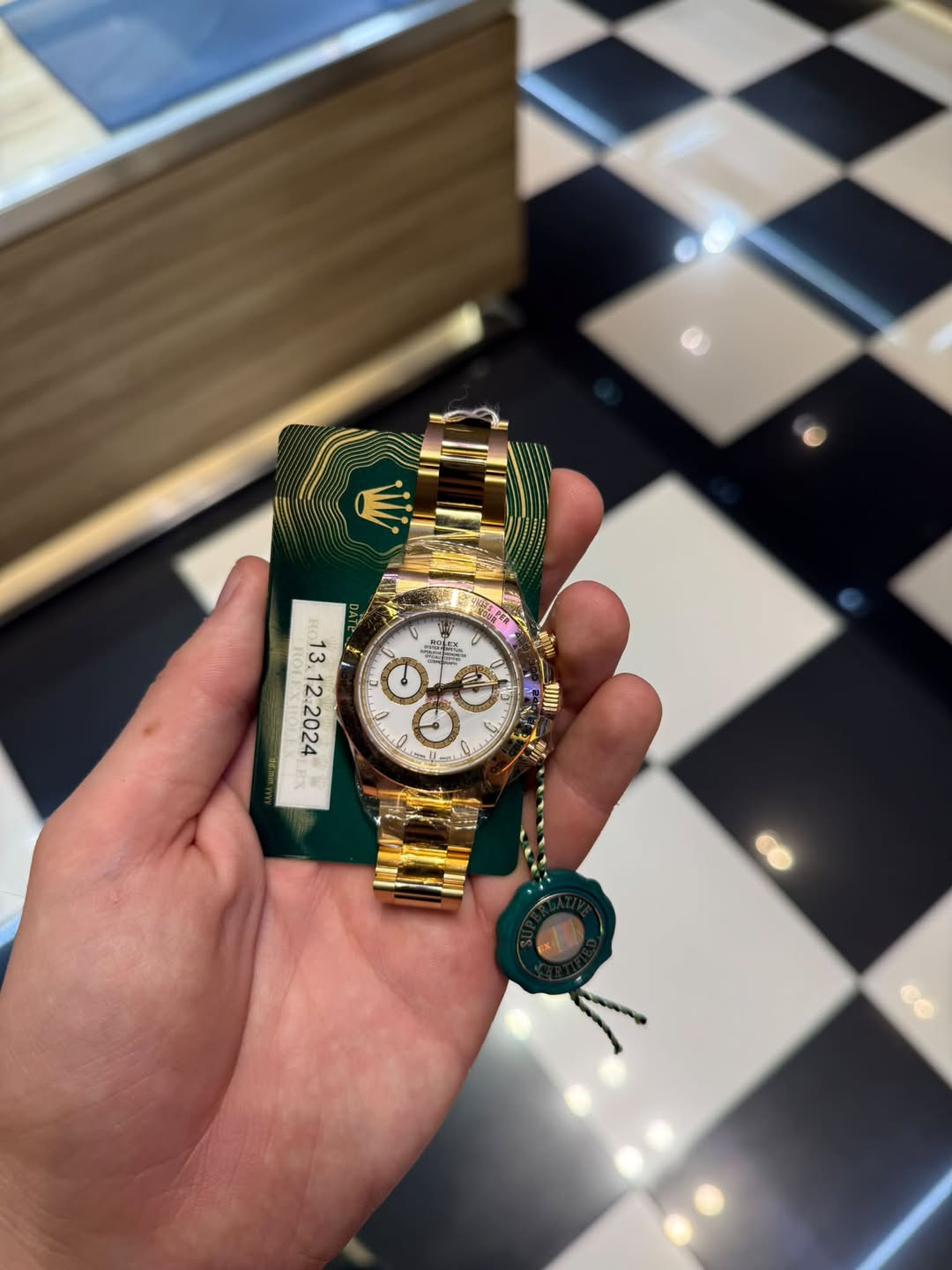 May be an image of wrist watch and text