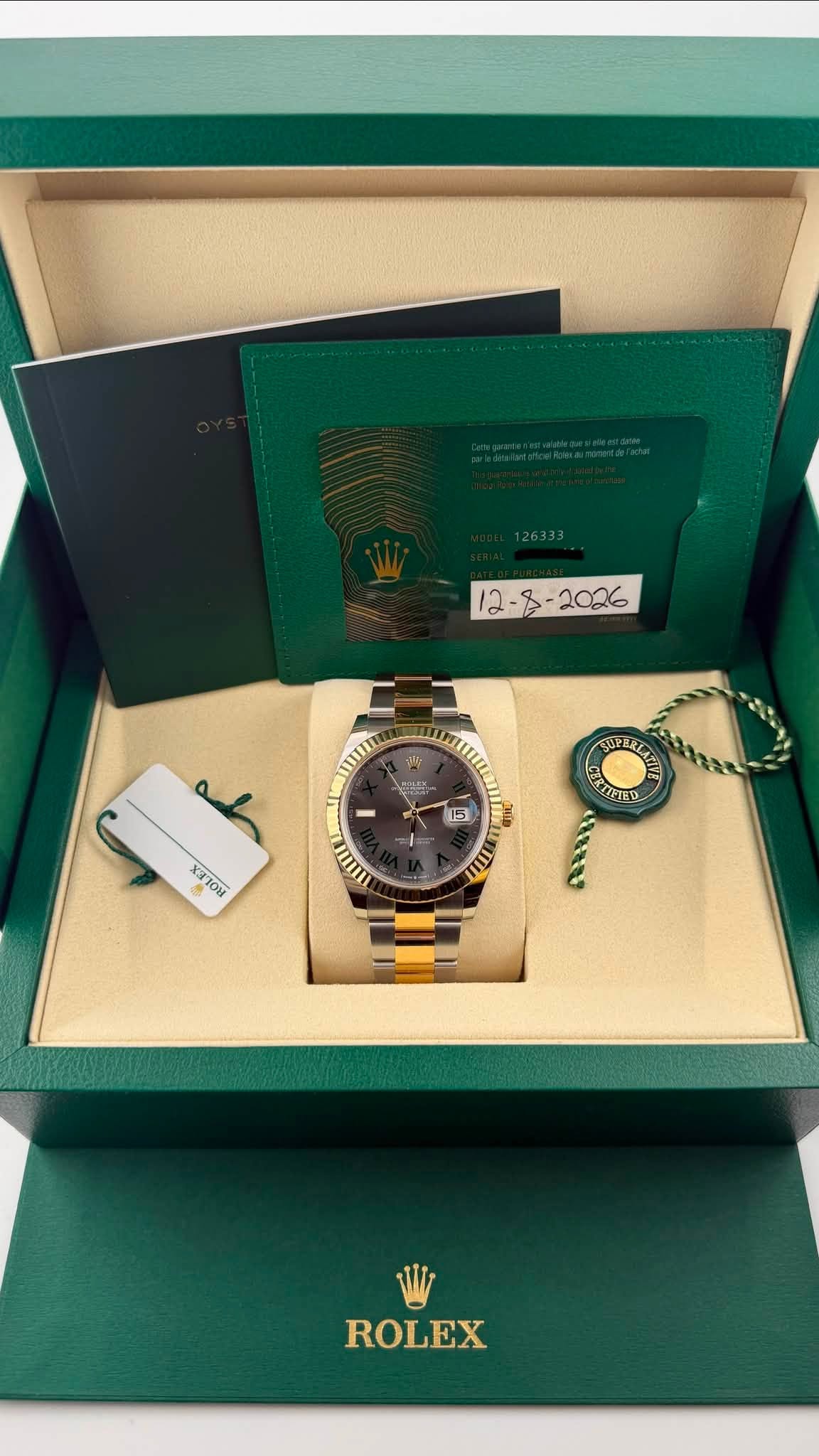 May be an image of wrist watch and text