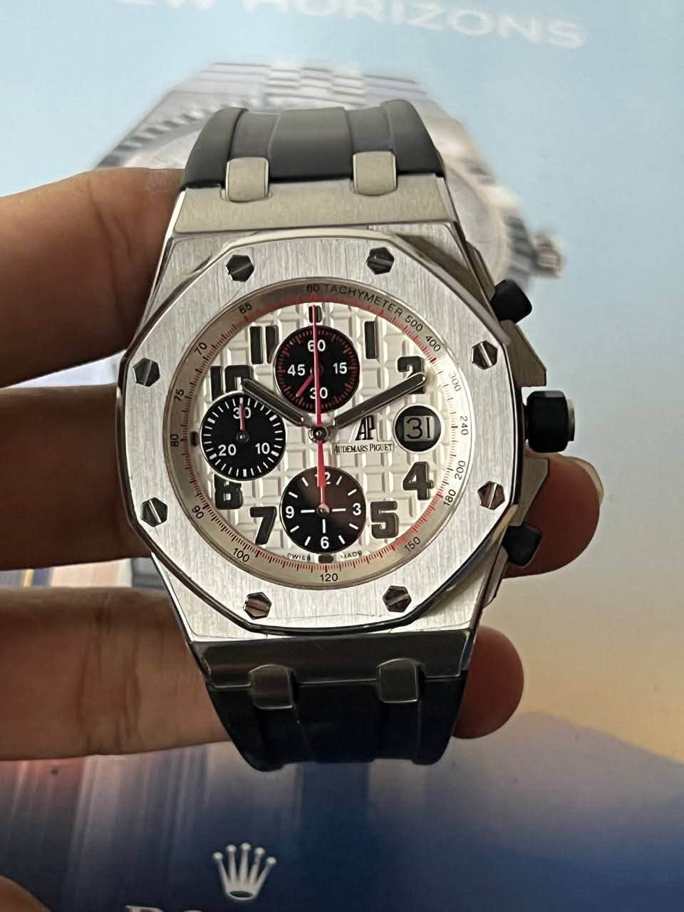 May be an image of wrist watch and text