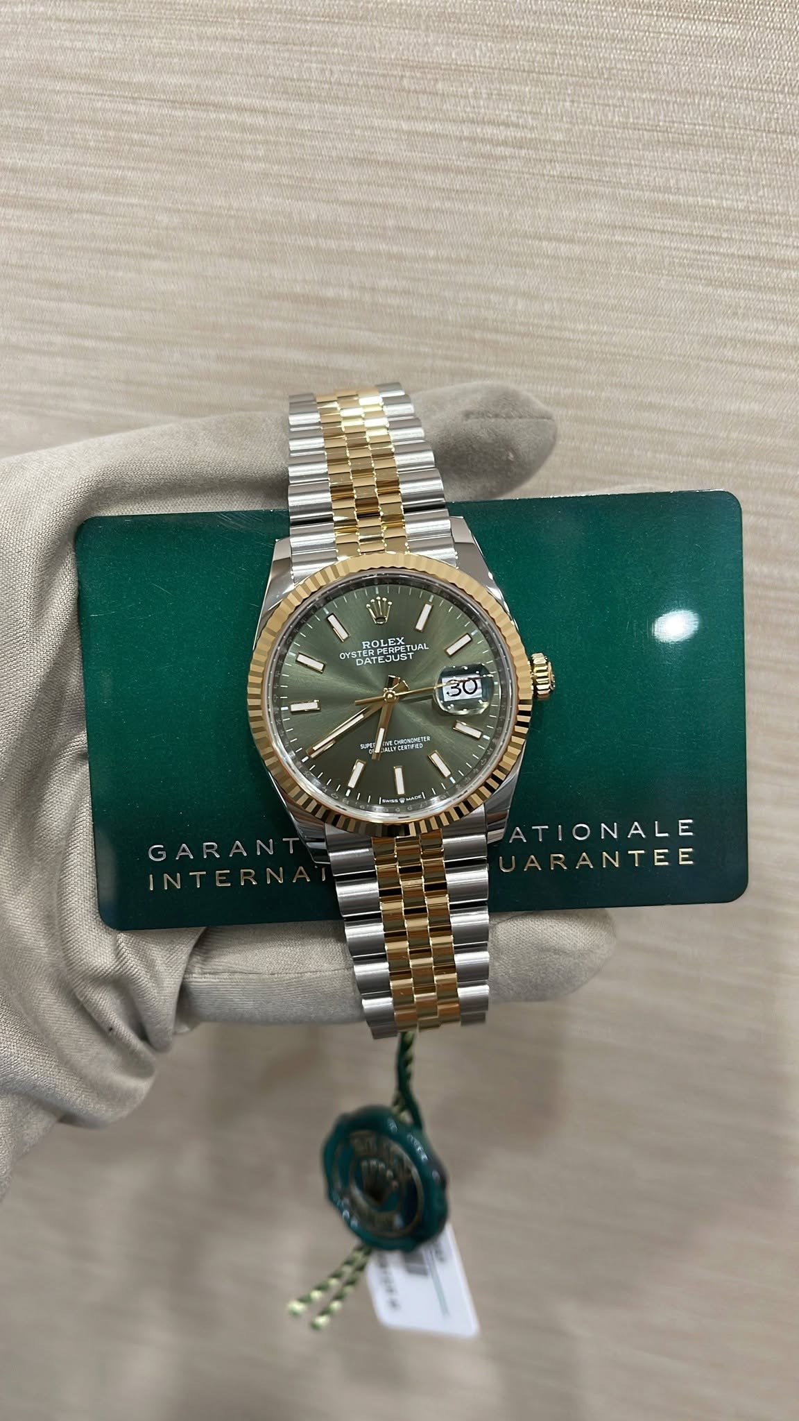 May be an image of wrist watch and text