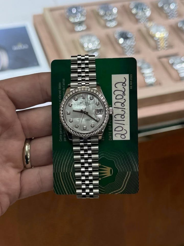 May be an image of wrist watch and text