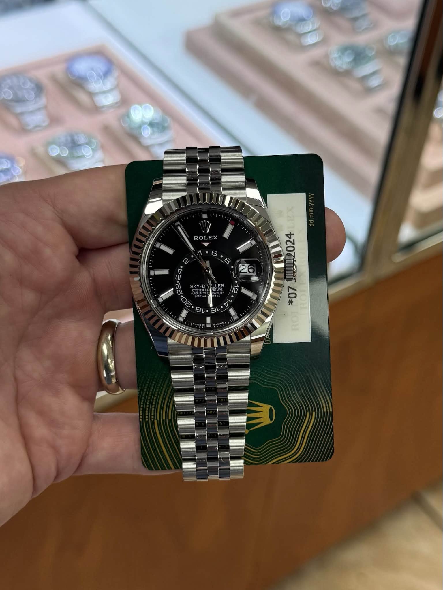 May be an image of wrist watch and text
