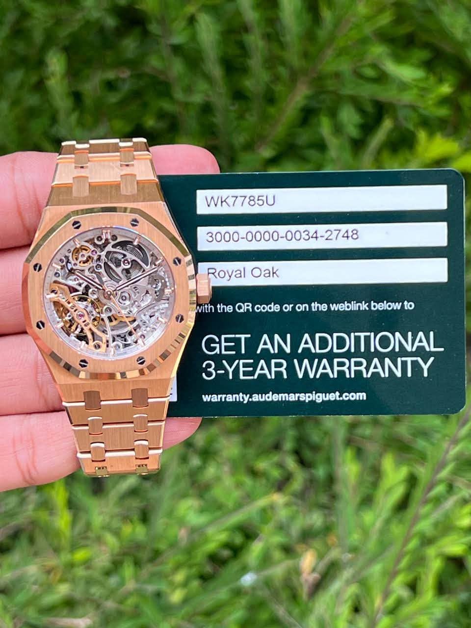 May be an image of wrist watch and text that says 'WK7785U Royal Oak mwith the QR code or on the weblink below to GET AN ADDITIONAL 3-YEAR WARRANTY waranty.audemarspiguet.com Can'