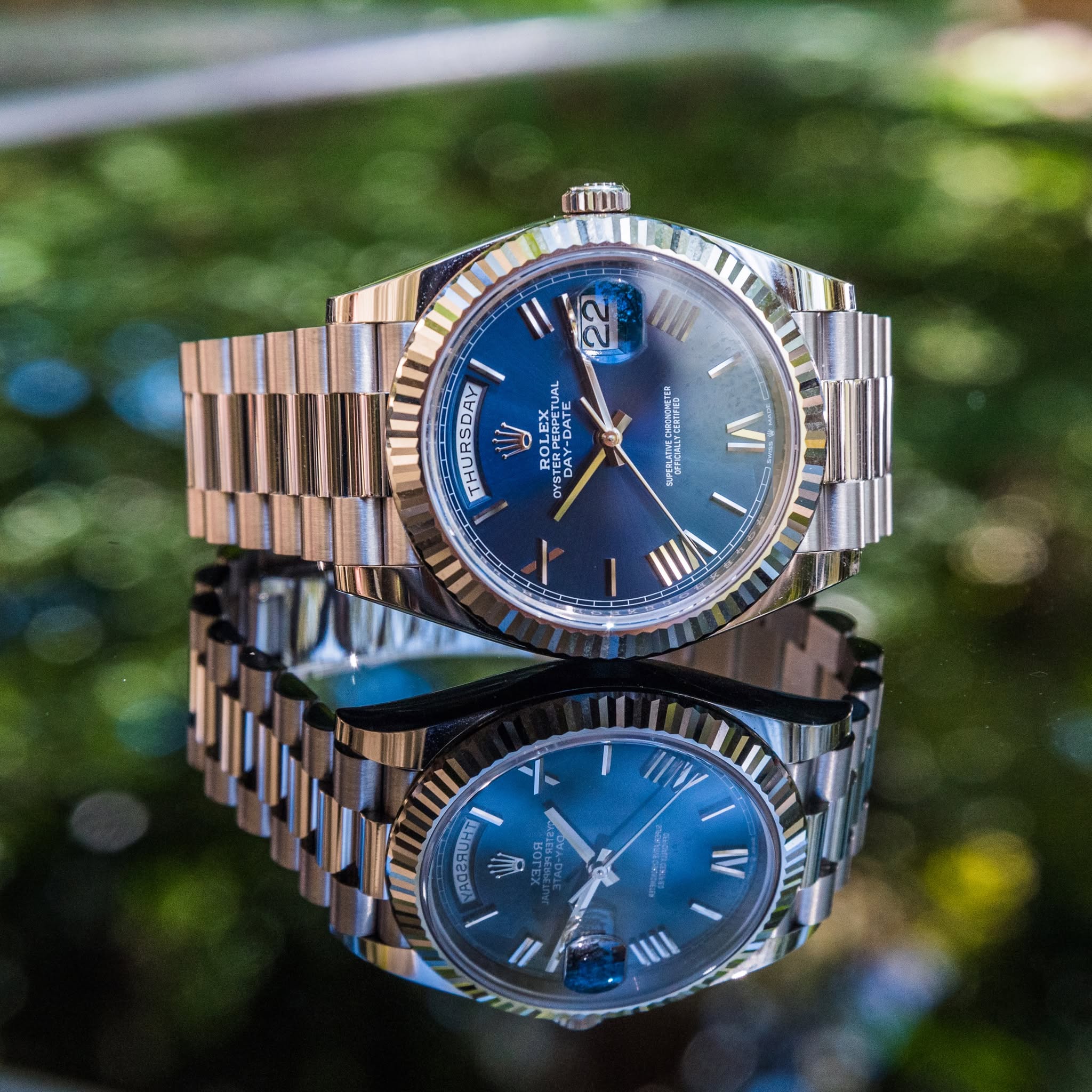 May be an image of wrist watch and text