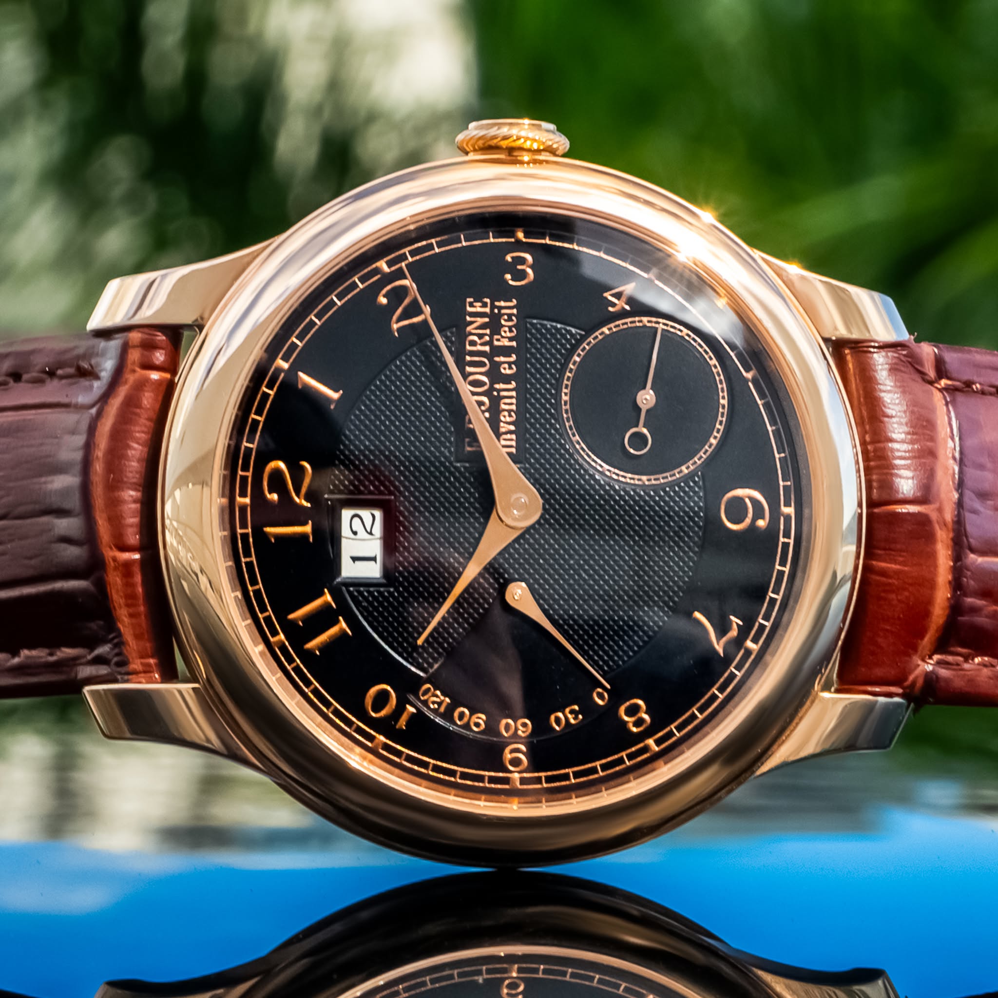 May be an image of wrist watch and text
