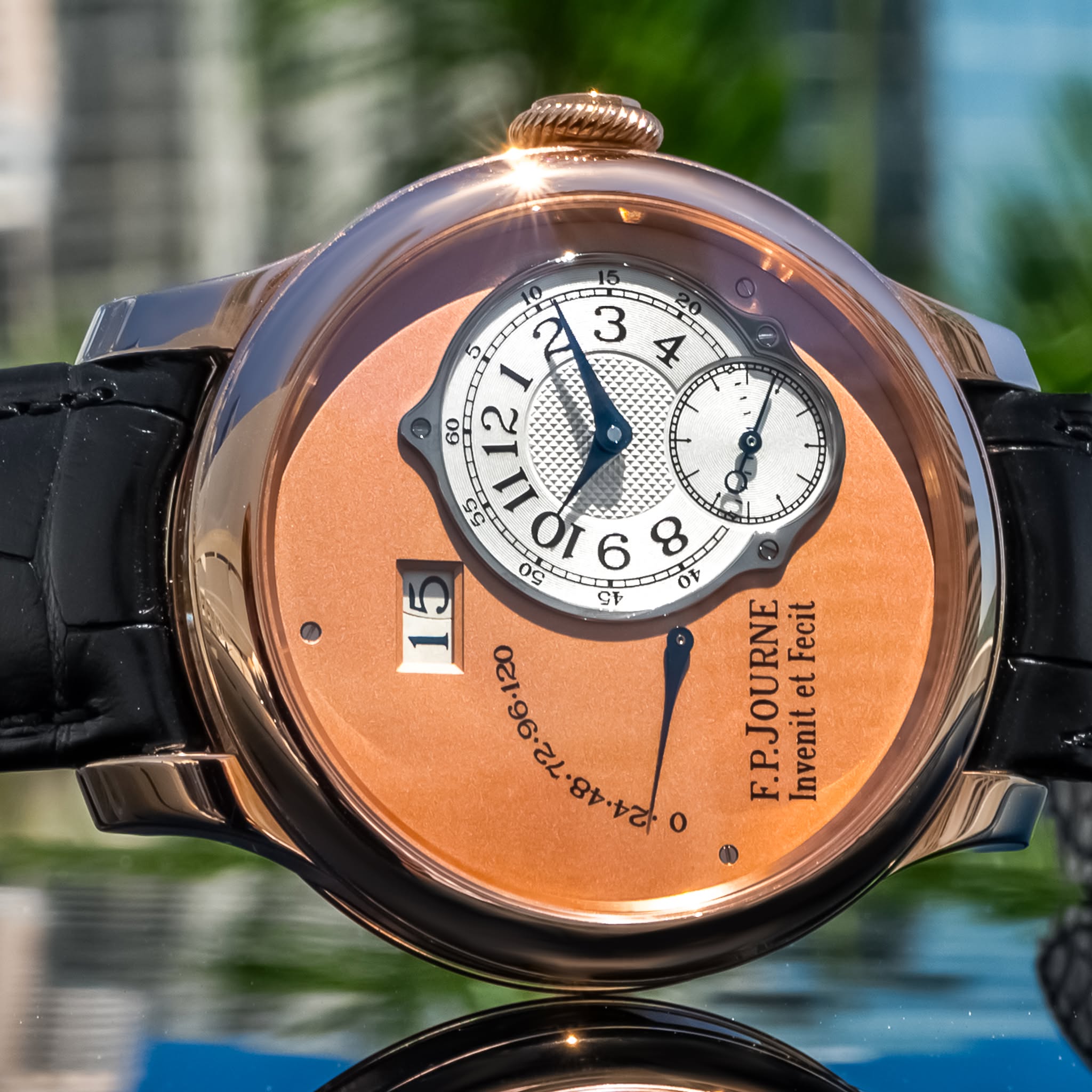 May be an image of wrist watch and text