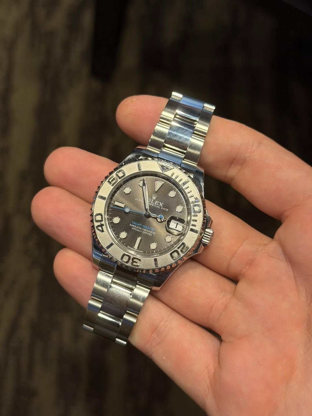 May be an image of wrist watch and text