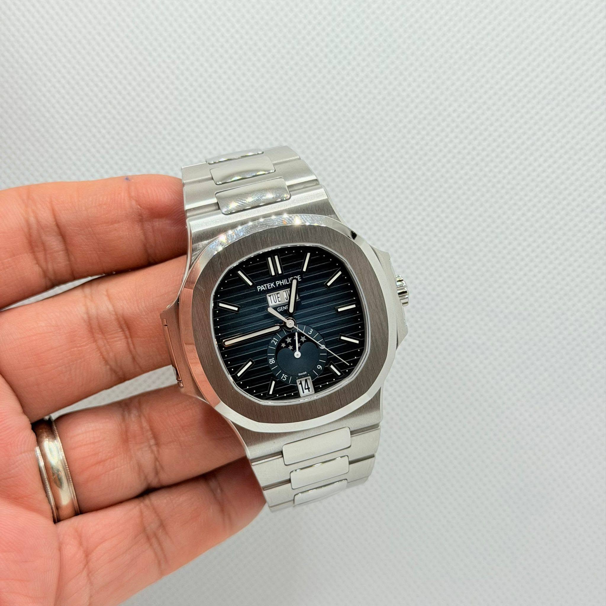 May be an image of wrist watch and text