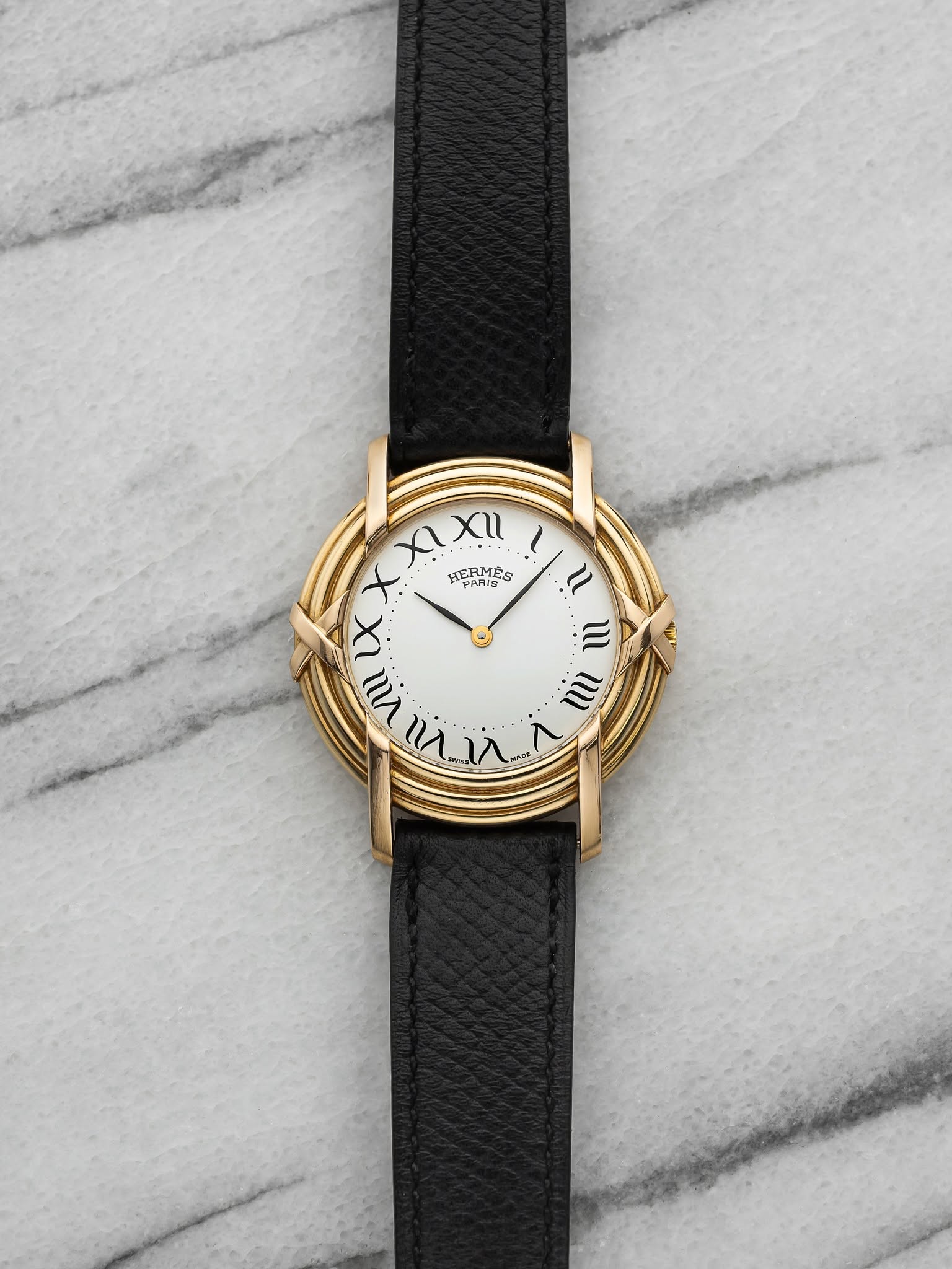May be an image of wrist watch and leather