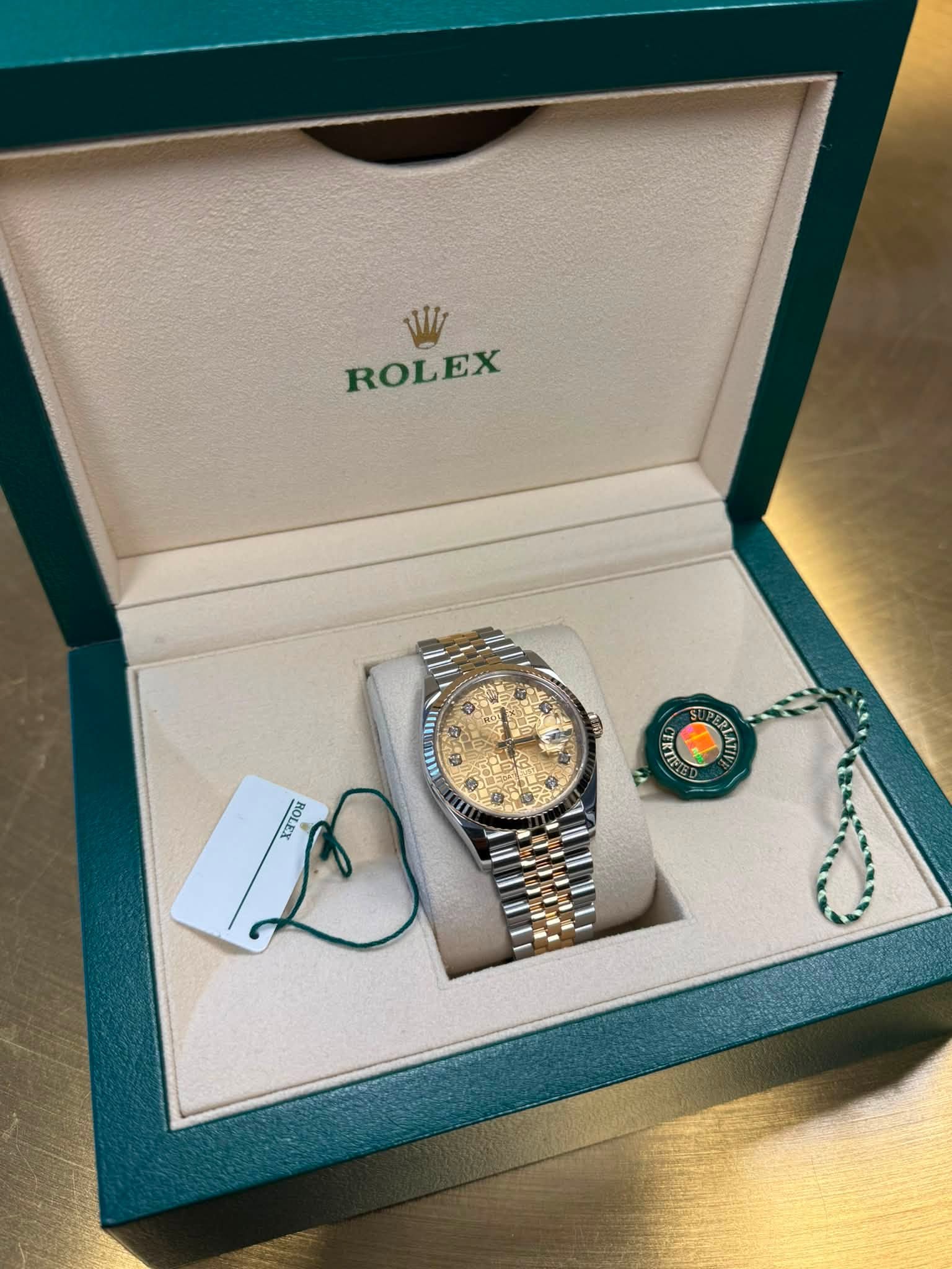 May be an image of wrist watch and text that says 'W ROLEX S mI AEU 0 ® nom LATI'