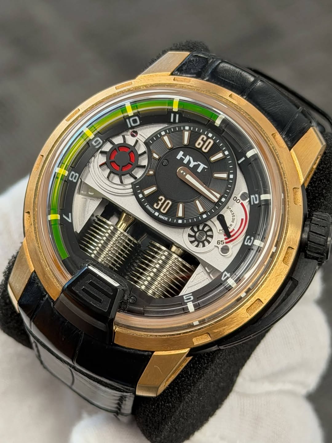 May be an image of wrist watch and text